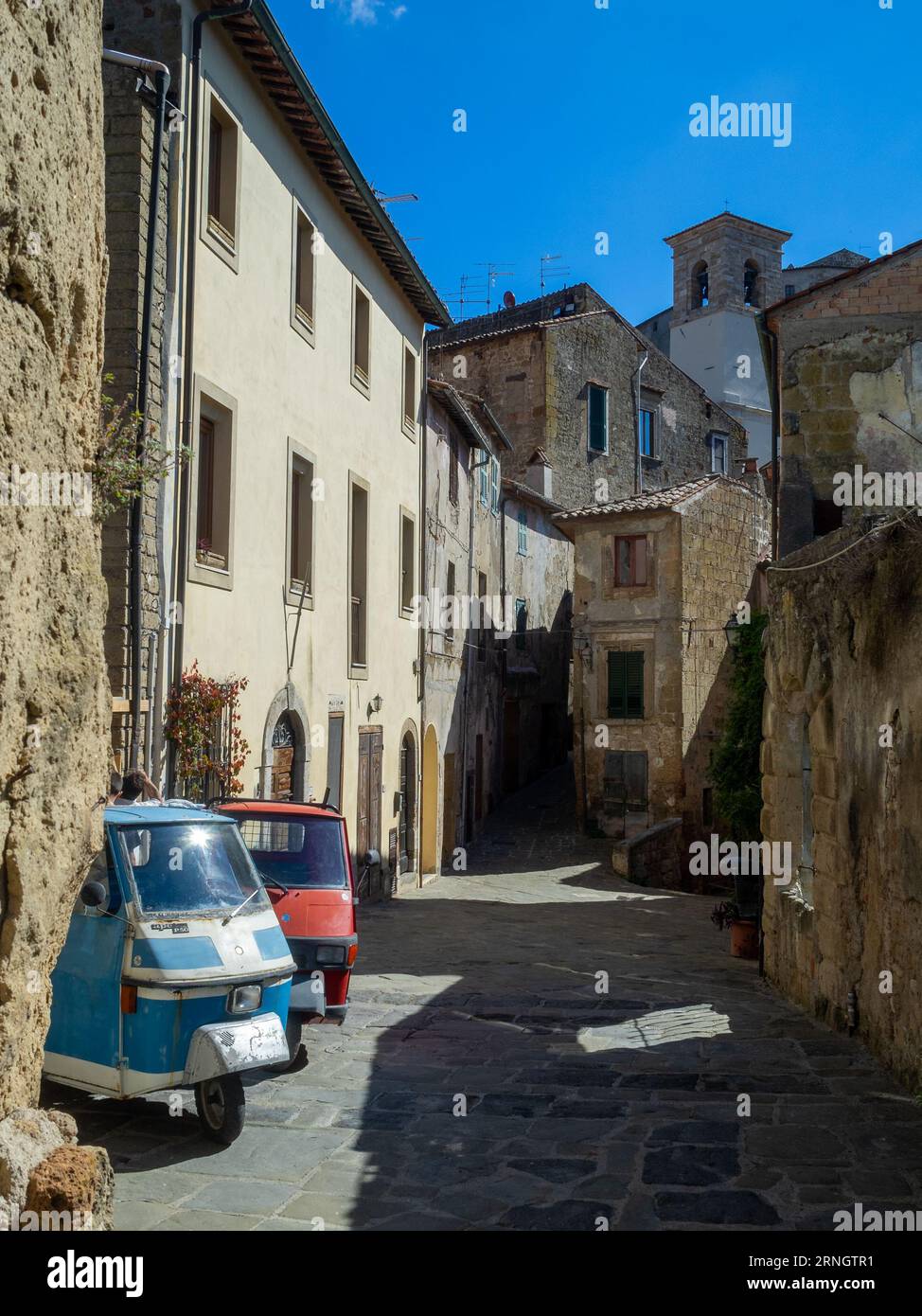 Piaggio tricycles parked in Sorano street Stock Photo