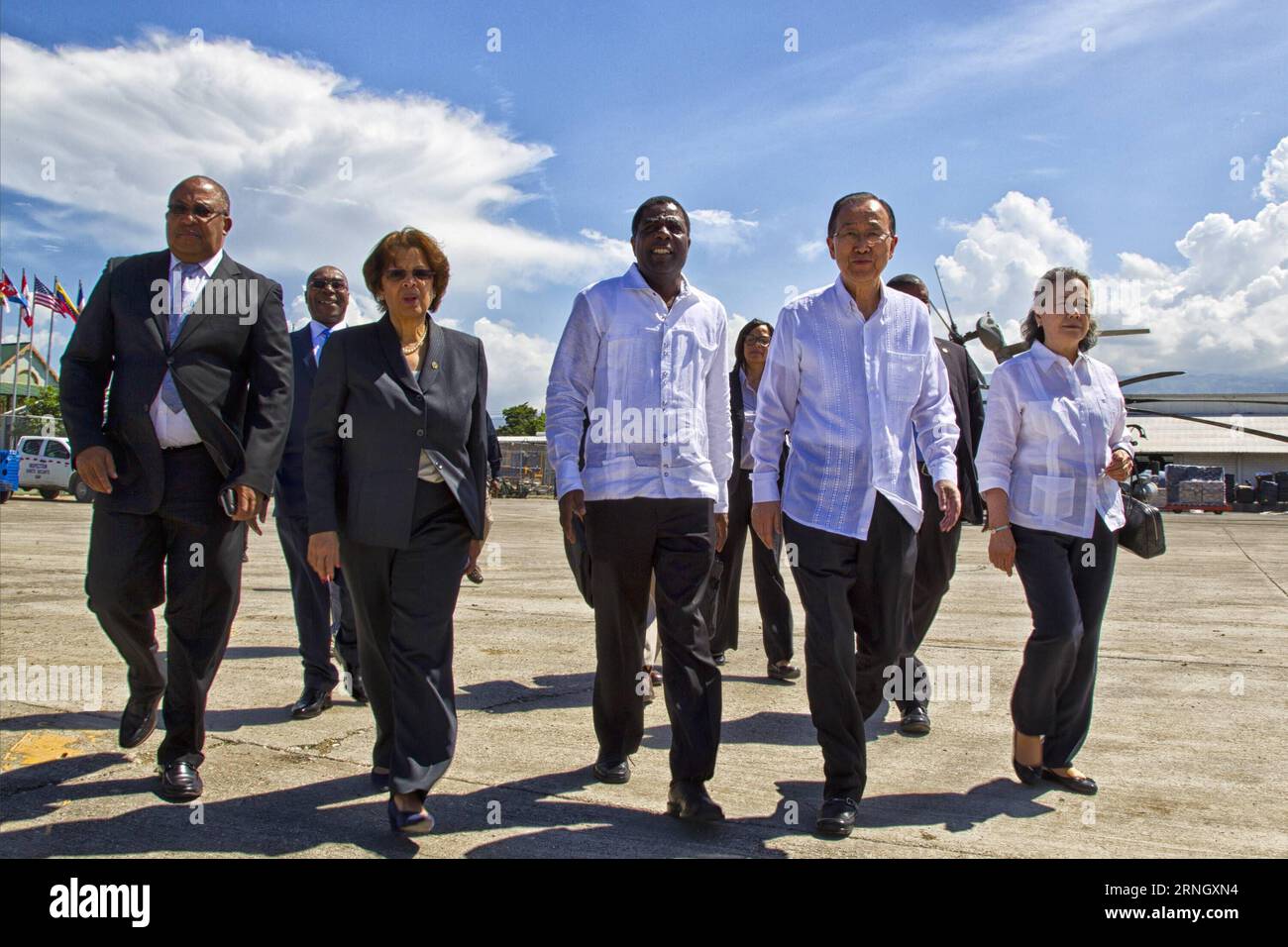 Image provided by the United Nations Stabilization Mission in Haiti (MINUSTAH) shows UN Secretary-General Ban Ki-moon (2nd R) arriving at the Port-au-Prince International Airport, accompanied by Haitian Prime Minister Enex Jean-Charles (C) and UN secretary-general s special representative in Haiti and head of MINUSTAH Sandra Honore (2nd L), in Port-au-Prince, Haiti, on Oct. 15, 2016. Ban arrived on Saturday in Haiti to make a tour to the areas hardest hit by Hurricane Matthew and met with government officials and humanitarian organizations working in the country. MINUSTAH) (jg) (fnc) MANDATORY Stock Photo