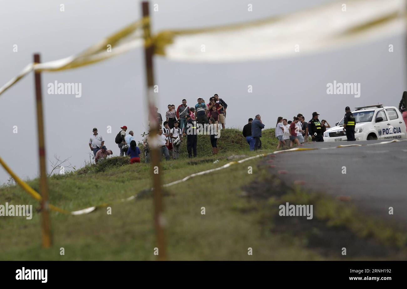 (161021) -- CINCHONA, Oct. 21, 2016 -- People gather at the site where a bus carrying 30 tourists fell off a 20-meter ditch, near the town of Cinchona, in the province of Alajuela, Costa Rica, on Oct. 20, 2016. At least 12 people were killed and 18 others injured in Costa Rica on Thursday when a bus carrying 30 tourists fell off a 20-meter ditch. Costa Rican President Luis Guillermo Solis declared three days of national mourning on Oct. 20-22, during which the national flag would be flown at half mast. Kent Gilbert) (fnc) (ce)(yy) COSTA RICA-CINCHONA-ACCIDENT-BUS e KENTxGILBERT PUBLICATIONxNOT Stock Photo