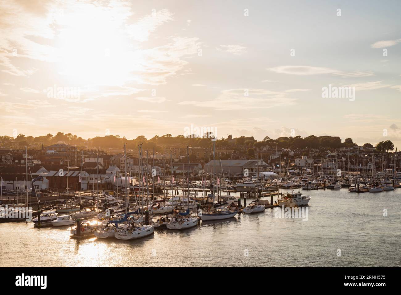 West Cowes marina on the Isle of Wight at sunset on a golden summer evening Stock Photo