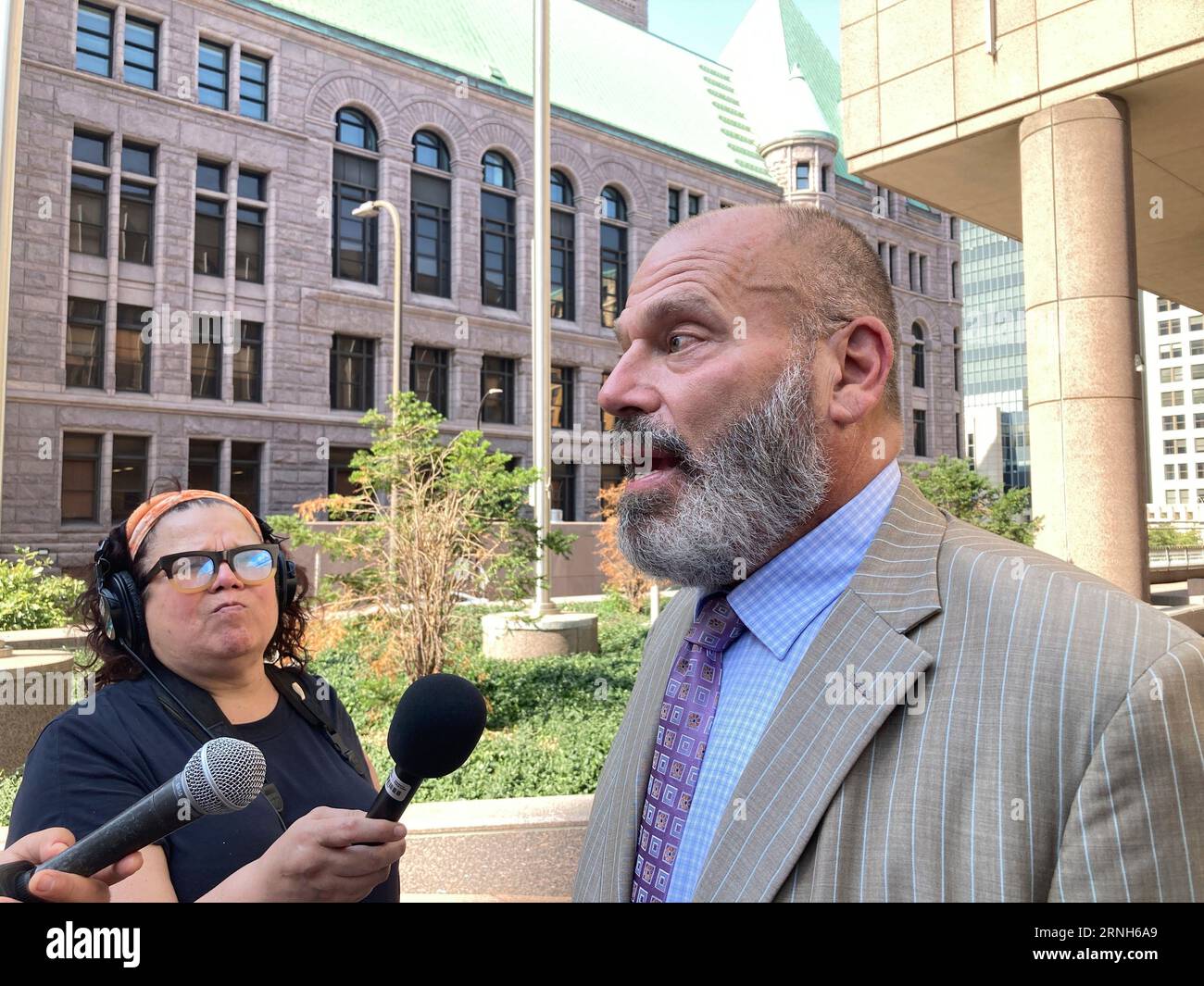 Defense attorney Paul Applebaum speaks to reporters outside the