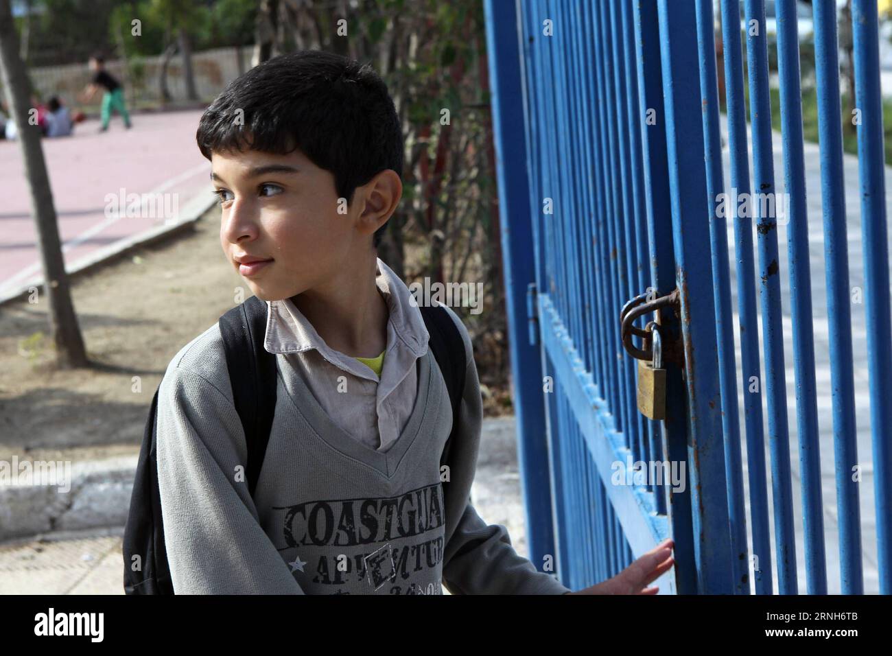 A young boy from Syria waits in the courtyard of the 2nd Tavros Elementary School to enter his classroom, in Athens, Greece on Oct. 19, 2016. Under the new refugee schooling program which was introduced in early October by the Greek Ministry of Education, a total of 10,000 refugee children aged 6 to 15 years old in Greece are expected to attend four-hour lessons every day in 150 schools all over Greece within the next few weeks. ) GREECE-ATHENS-REFUGEE CHILDREN-EDUCATION MariosxLolos PUBLICATIONxNOTxINxCHN   a Young Boy from Syria Waits in The Courtyard of The 2nd Tavros Elementary School to E Stock Photo