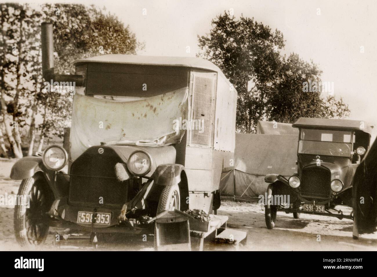 A 1920s photograph of a Studebaker reconfigured by its California owner into a camping and traveling vehicle, equipped with a wood-burning store. Stock Photo