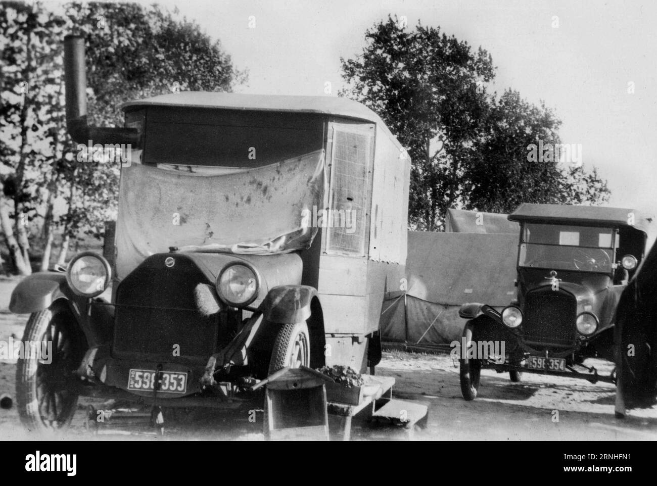 A 1920s photograph of a Studebaker reconfigured by its California owner into a camping and traveling vehicle, equipped with a wood-burning store. Stock Photo