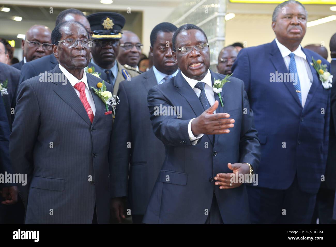 (161118) -- VICTORIA FALLS (ZIMBABWE), Nov. 18, 2016 -- Zimbabwean President Robert Mugabe (1st, L) visits the terminal of Victoria Falls International Airport in Victoria Falls, Zimbabwe, on Nov. 18, 2016. Mugabe on Friday commissioned the upgraded Victoria Falls International Airport that was built with support from China. ) ZIMBABWE-VICTORIA FALLS-CHINESE-BUILT AIRPORT-INAUGURATION ChenxYaqin PUBLICATIONxNOTxINxCHN   Victoria Falls Zimbabwe Nov 18 2016 Zimbabwean President Robert Mugabe 1st l visits The Terminal of Victoria Falls International Airport in Victoria Falls Zimbabwe ON Nov 18 20 Stock Photo