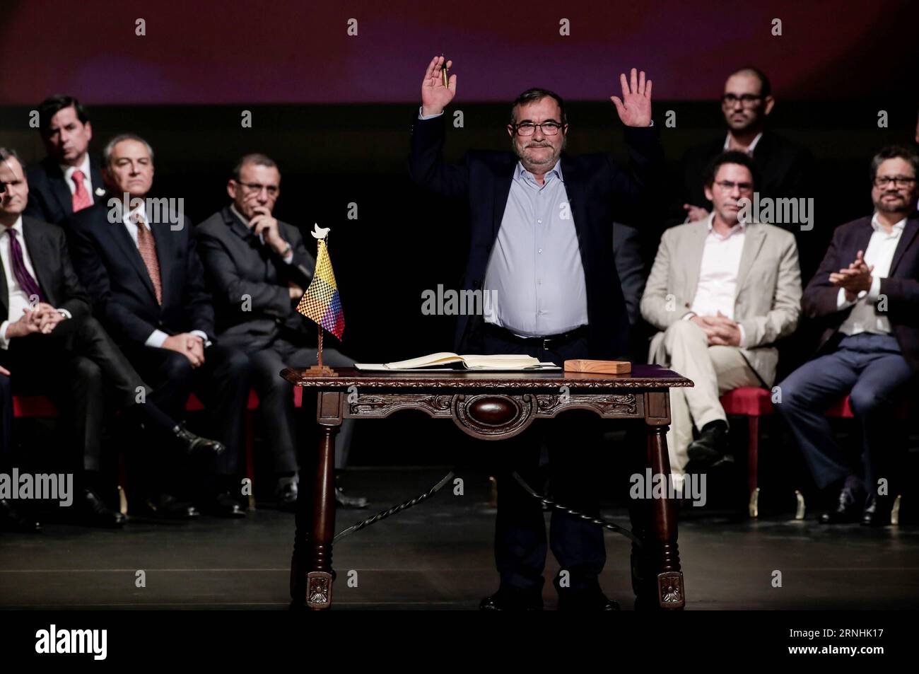 Kolumbien schließt neues Abkommen mit FARC-Guerilla (161124) -- BOGOTA, Nov. 24, 2016 -- The leader of the Revolutionary Armed Forces of Colombia (FARC), Rodrigo Londono (front), participates in the signing ceremony of a revised peace agreement between the Colombian government and the FARC at Colon Theater in Bogota, capital of Colombia, on Nov. 24, 2016. Colombian President Juan Manuel Santos and Rodrigo Londono signed a revised peace agreement here on Thursday. This revised agreement will be sent to Congress. ) COLOMBIA-BOGOTA-GOVERNMENT-FARC-REVISED PEACE AGREEMENT-SIGNING JhonxPaz PUBLICAT Stock Photo