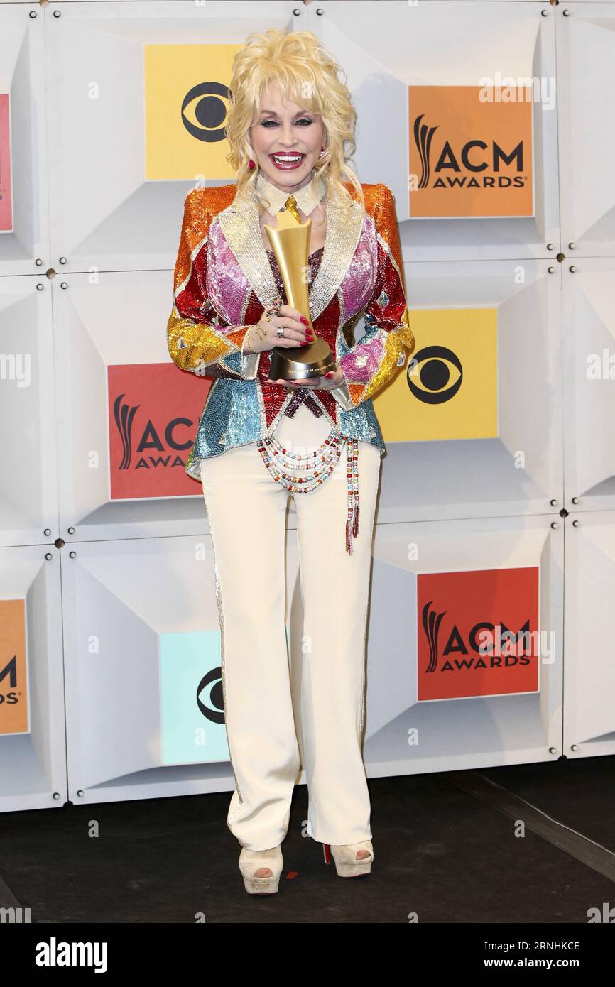 Singer-songwriter and producer Dolly Parton, winner of the Tex Ritter Award for Dolly Parton s Coat of Many Colors, poses in the press room during the 51st Academy of Country Music Awards at MGM Grand Garden Arena on April 3, 2016 in Las Vegas, Nevada. USA - 2016 - 51st Academy Of Country Music Awards in Las Vegas - Press Room - Dolly Parton DebbyxWong PUBLICATIONxNOTxINxCHN   Singer Songwriter and Producer Dolly Parton Winner of The Tex Ritter Award for Dolly Parton S Coat of MANY Colors Poses in The Press Room during The 51st Academy of Country Music Awards AT MGM Grand Garden Arena ON April Stock Photo