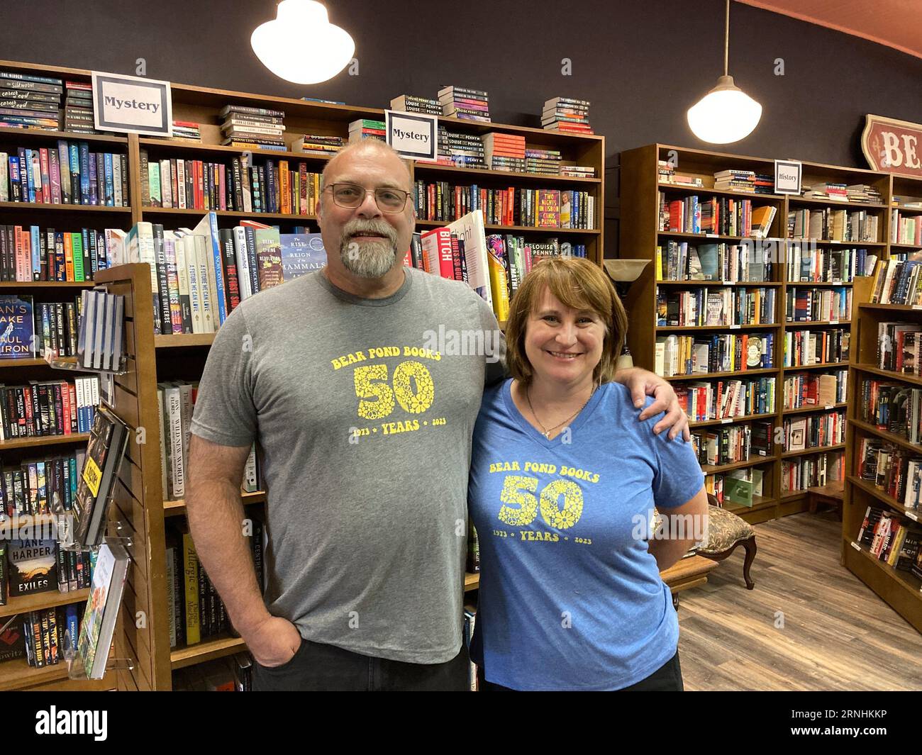 Bear Pond Books owners Rob Kasow and Claire Benedict stand inside their ...