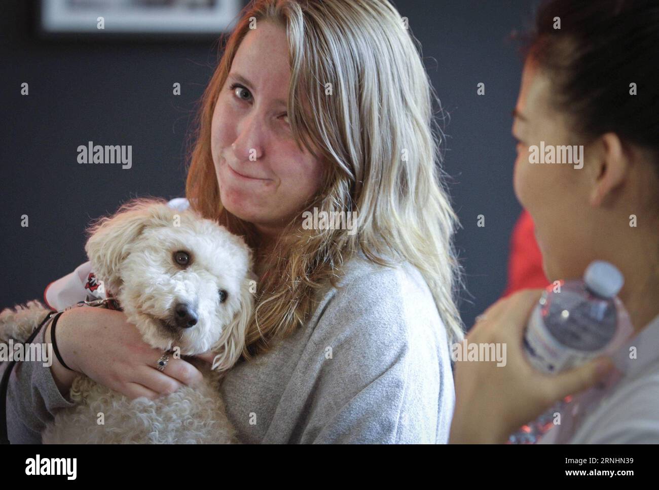 (161130) -- VANCOUVER, Nov. 30, 2016 -- A student hugs a dog during the puppy therapy event at Simon Fraser University in Vancouver, Canada, Nov. 29, 2016. Simon Fraser University invited puppies to campus during exam time to help students take a break from the stress of end-of-term assignments. )(gj) CANADA-VANCOUVER-PUPPY THERAPY LiangxSen PUBLICATIONxNOTxINxCHN   Vancouver Nov 30 2016 a Student Hugs a Dog during The Puppy THERAPY Event AT Simon Fraser University in Vancouver Canada Nov 29 2016 Simon Fraser University invited Puppies to Campus during Exam Time to Help Students Take a Break f Stock Photo