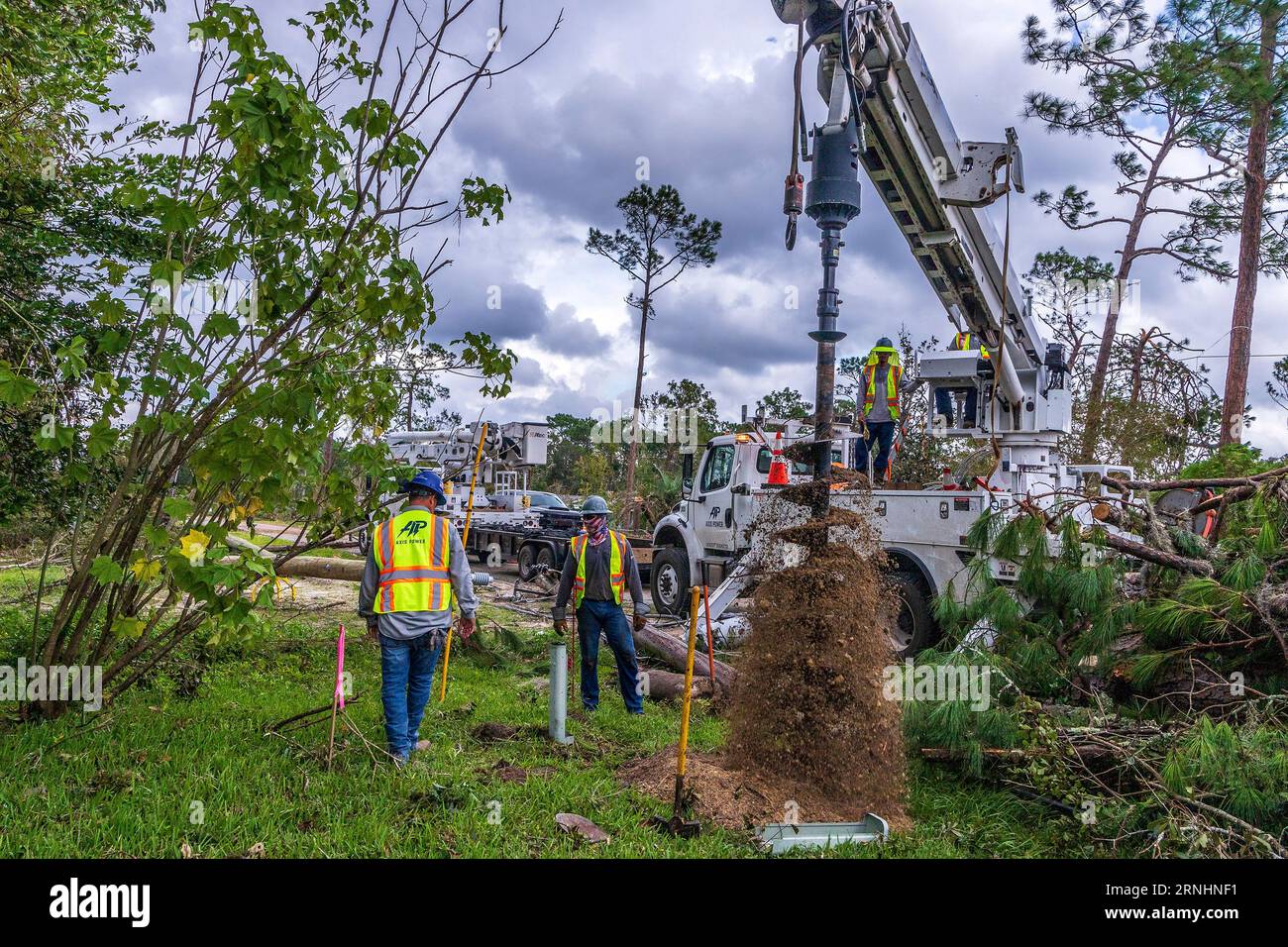 Perry, United States. 01st Sep, 2023. Utility workers begin the process of installing new power poles and stringing electrical lines in the aftermath of Hurricane Idalia, September 1, 2023 in Perry, Florida. The small town of 7,000 was pummeled by Hurricane Idalia shredding trees and destroying homes. Credit: Steve Zumwalt/FEMA/Alamy Live News Stock Photo