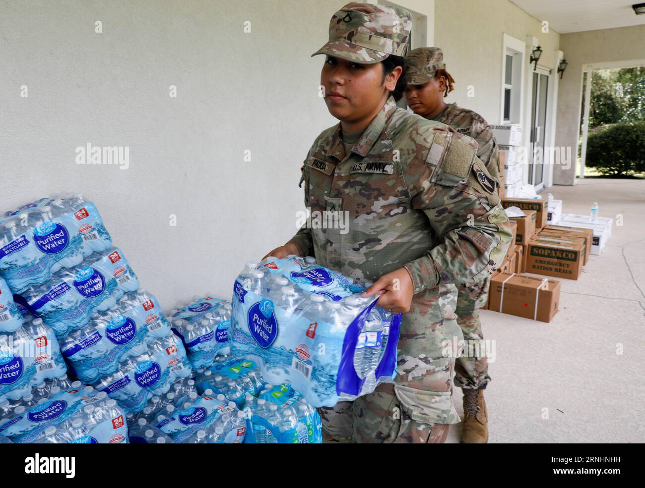 Cedar Key, United States. 31st Aug, 2023. U.S Army soldiers with the Florida National Guard, 53d Brigade Support Battalion, load bottled water into a residents vehicle in the aftermath of Hurricane Idalia, August 31, 2023 in Cedar Key, Florida. Credit: SSgt. Cassandra Vieira/U.S Army/Alamy Live News Stock Photo