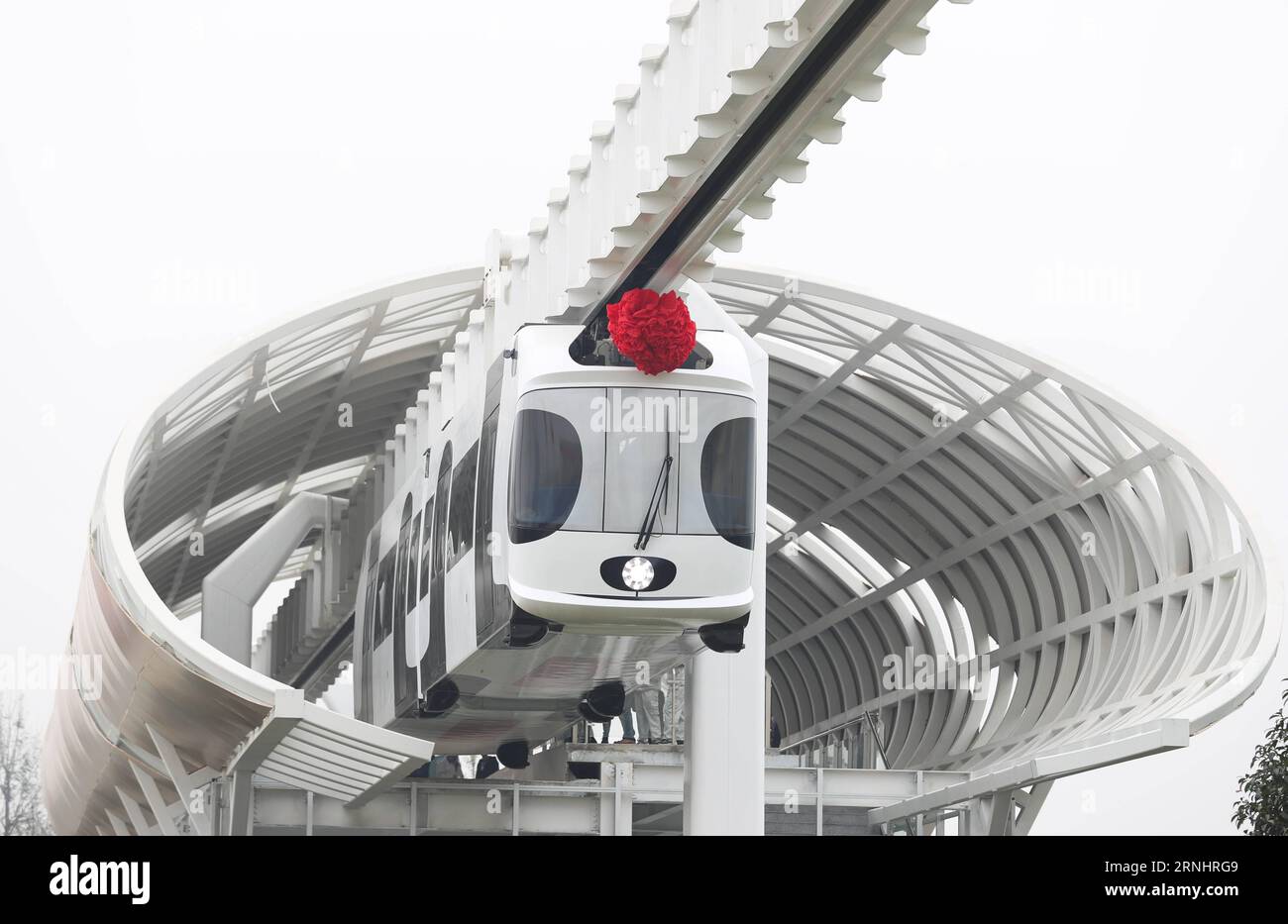 BEIJING -- A lithium-battery powered train suspended from a railway line runs in Chengdu, capital of southwest China s Sichuan Province, Nov. 21, 2016. China s first suspension railway line has conducted two-month test run. China achieved major breakthroughs in scientific and technological development in 2016. ) (ry) CHINA-SCIENCE, TECHNOLOGY-ACHIEVEMENTS (CN) JiangxHongjing PUBLICATIONxNOTxINxCHN   Beijing a Lithium Battery Powered Train Suspended from a Railway Line runs in Chengdu Capital of Southwest China S Sichuan Province Nov 21 2016 China S First Suspension Railway Line has conducted T Stock Photo