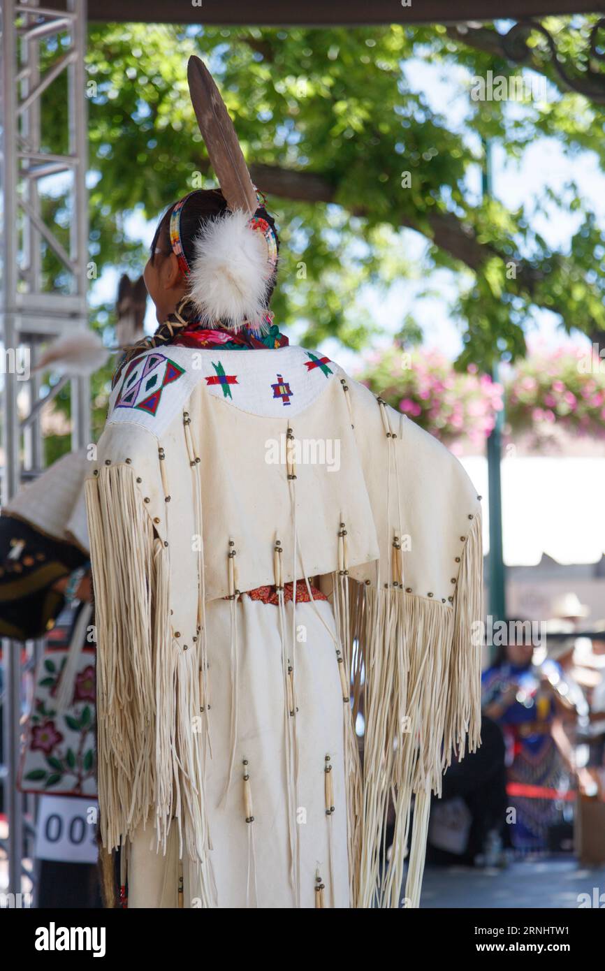 A young girl from a Native American tribe competes for best regalia at the Santa Fe Indian Market 2023 Stock Photo