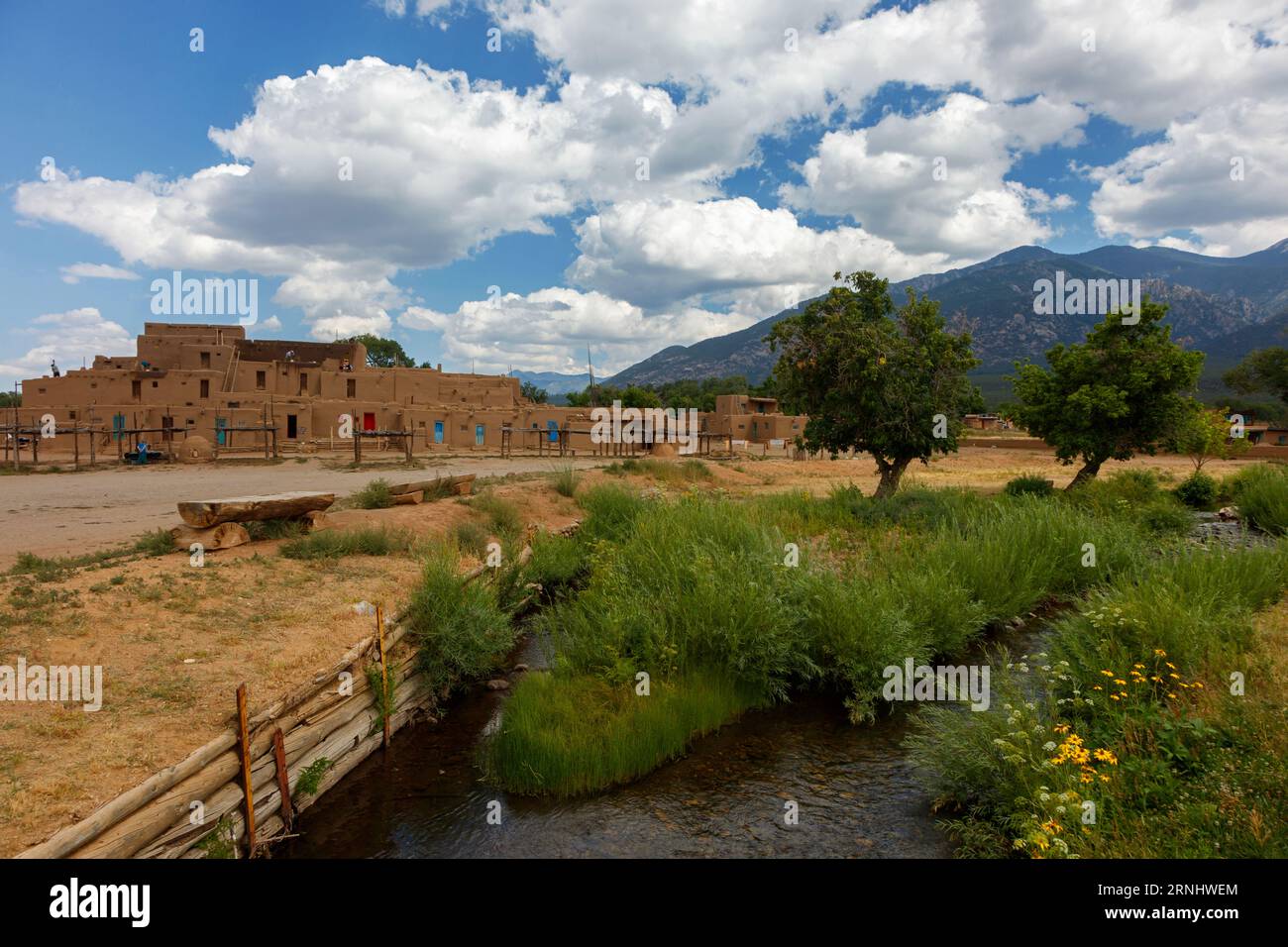 The Taos Pueblo was built by the Tiwa tribe and is one of the oldest continuously inhabited places in the US - New Mexico Stock Photo