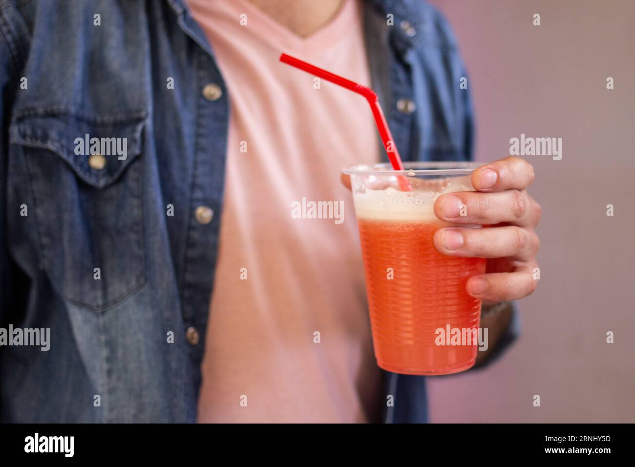 Men with a traditional drink from Chile called 'Terremoto' in his hand Stock Photo