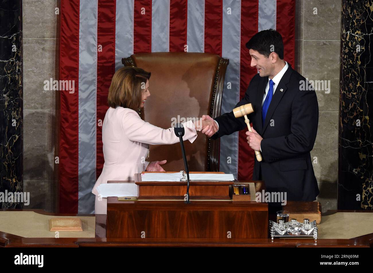 (170103) -- WASHINGTON, Jan. 3, 2017 -- Paul Ryan (R) receives the gavel from House Minority Leader Nancy Pelosi after being re-elected as House Speaker during the opening of the 115th U.S. Congress on Capitol Hill in Washington D.C., the United States, on Jan. 3, 2017. The 115th U.S. Congress convenes on Tuesday with Republican Paul Ryan re-elected as House Speaker as expected while outgoing Vice President Joe Biden presides over the old Senate chamber for the last time. ) U.S.-WASHINGTON D.C.-HOUSE SPEAKER-PAUL RYAN YinxBogu PUBLICATIONxNOTxINxCHN   Washington Jan 3 2017 Paul Ryan r receives Stock Photo