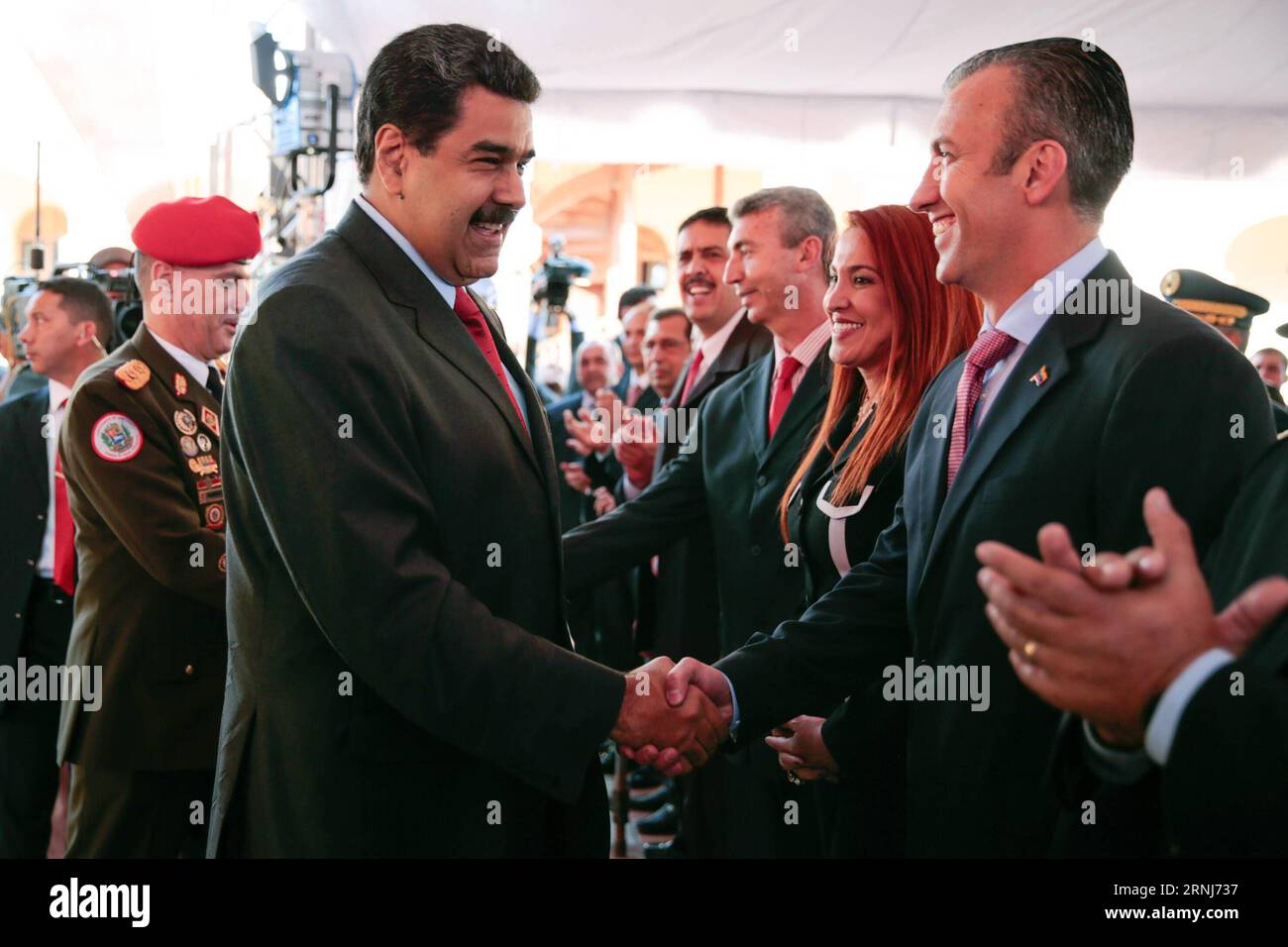 170104 -- CARACAS, Jan. 4, 2017 -- Venezuelan President Nicolas Maduro L F shakes hands with Vice President Tareck El Aissami in Caracas, Venezuela, Jan 4, 2017. Nicolas Maduro on Wednesday appointed Tareck El Aissami, 43, as vice president to replace Aristobulo Isturiz, who became minister for communes and social movements. Presidential Press/AVN djj VENEZUELA-CARACAS-NEW VICE PRESIDENT e AVN PUBLICATIONxNOTxINxCHN Stock Photo