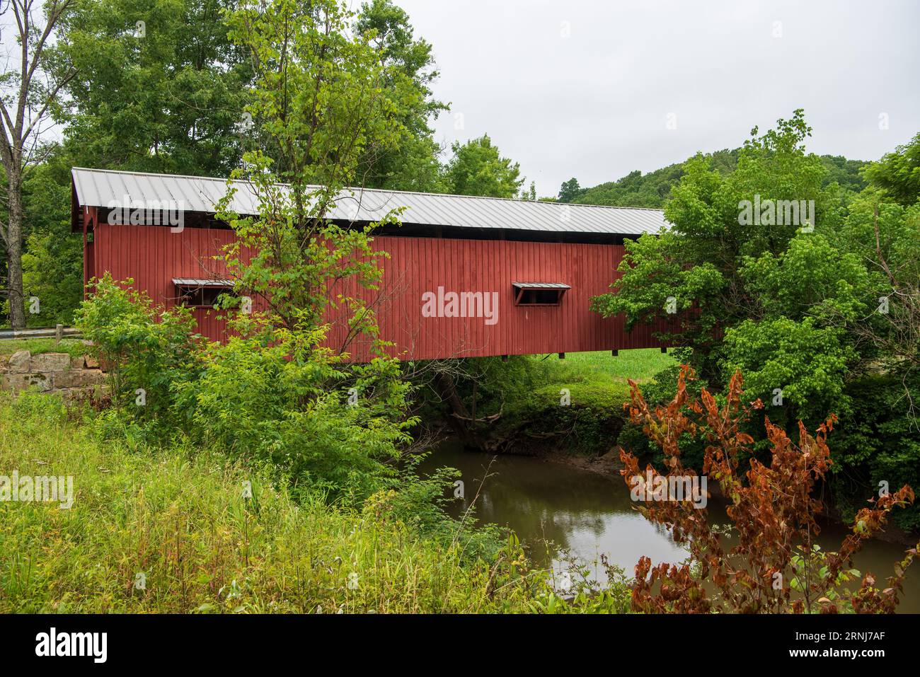 Bridge # 35-84-03 Shinn Covered Bridge was built in 1886 with a Burr Arch structure. It crosses the West Branch Wolf Creek on Palmer Road near Cutler Stock Photo
