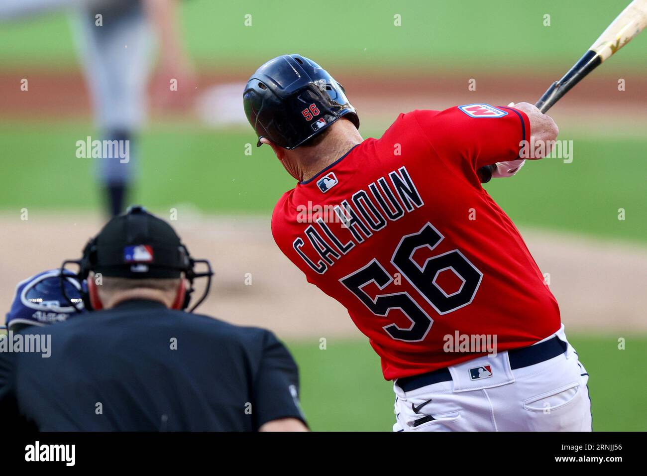CLEVELAND, OH - AUGUST 06: Cleveland Guardians first baseman Kole Calhoun  (56) doubles during the fifth inning of the Major League Baseball game  between the Chicago White Sox and Cleveland Guardians on