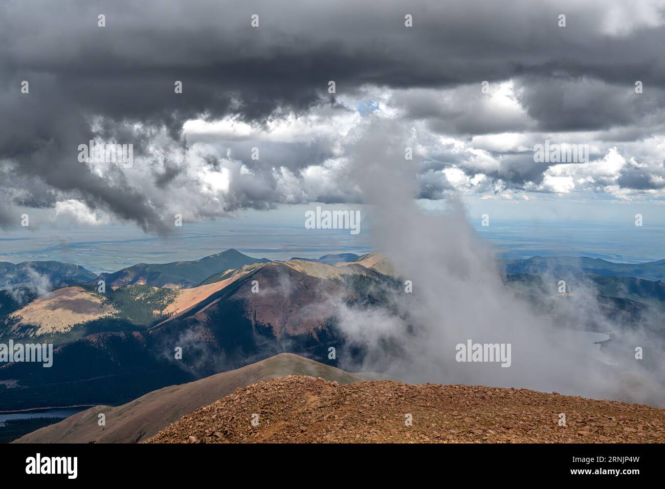 Pikes Peak Colorado Springs - summit view of clouds rocks and landscape / landscapes of Pike's Peak State Park Rocky Mountains USA in Summer Stock Photo