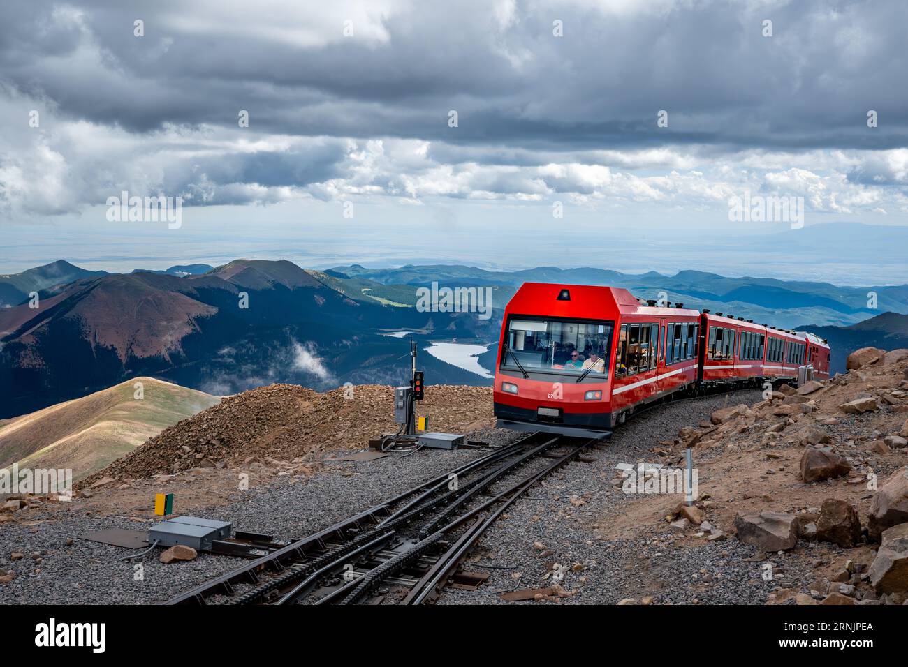 Pikes Peak cog railway at summit - view of clouds rocks and landscape of Pike's Peak State Park Rocky Mountains Colorado Springs railroad in Summer Stock Photo