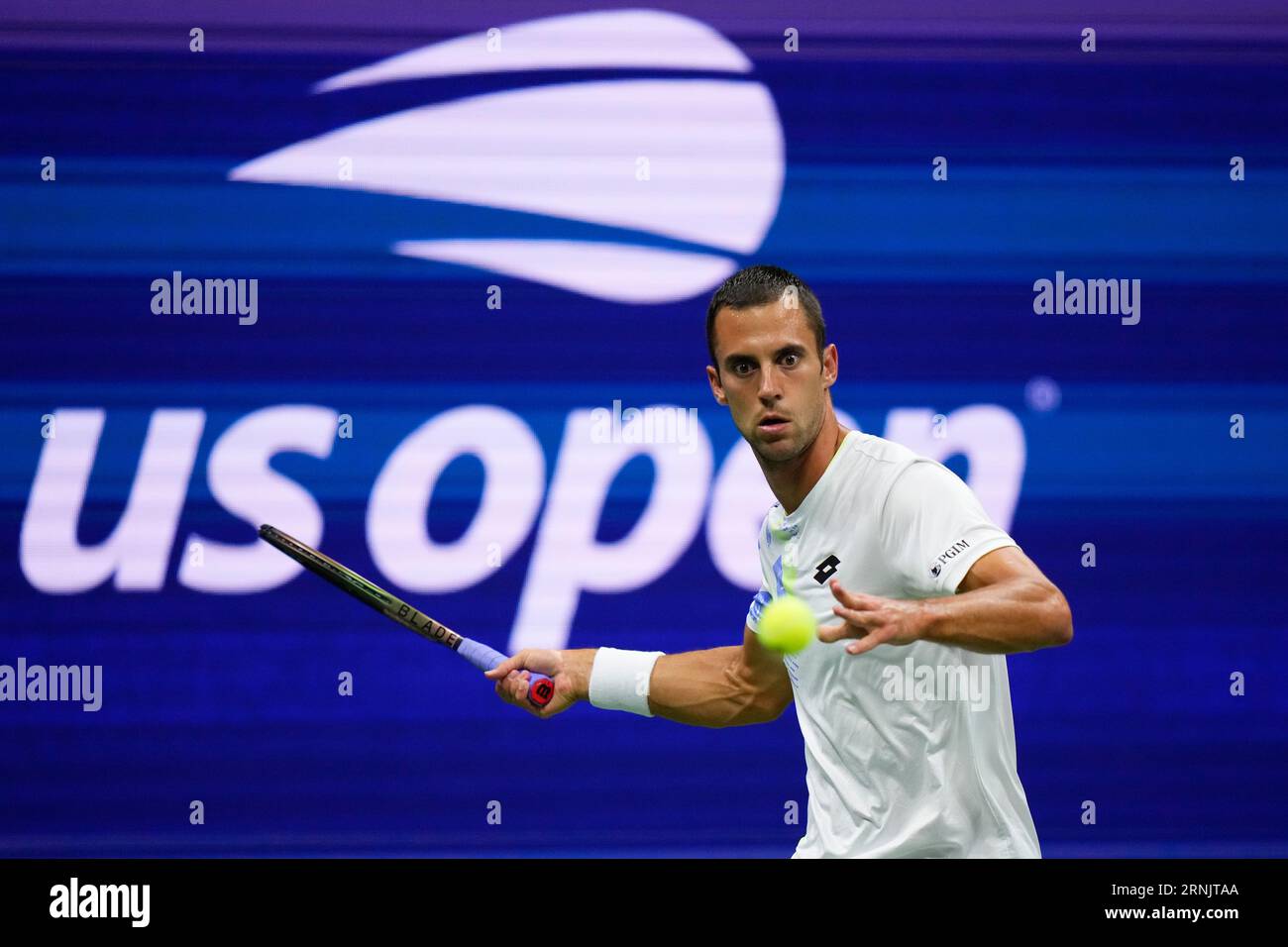 Laslo Djere, of Serbia, returns a shot to Novak Djokovic, of Serbia, during the third round of the U.S. Open tennis championships, Friday, Sept