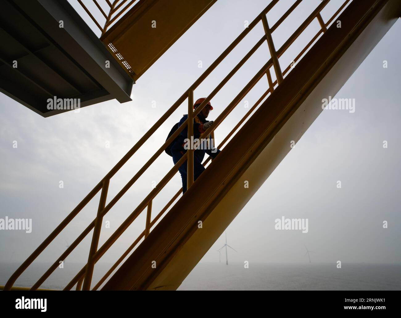 (170216) -- NANTONG, Feb. 16, 2017 -- An engineer checks a booster station in Rudong offshore wind farm of China General Nuclear Power Corporation (CGN) in Rudong County of Nantong City, east China s Jiangsu Province, Feb. 16, 2017. The Rudong offshore windpower project, which is located around 25-35 kilometers offshore Yangkou Port, comprises 38 4MW turbines with a total capacity of 152 MW. It is the first wind farm that require offshore wind turbines be installed at areas of at least 10 kilometers offshore and in water depth of at least 10 meters. ) (zkr) CHINA-JIANGSU-RUDONG-CGN OFFSHORE WI Stock Photo
