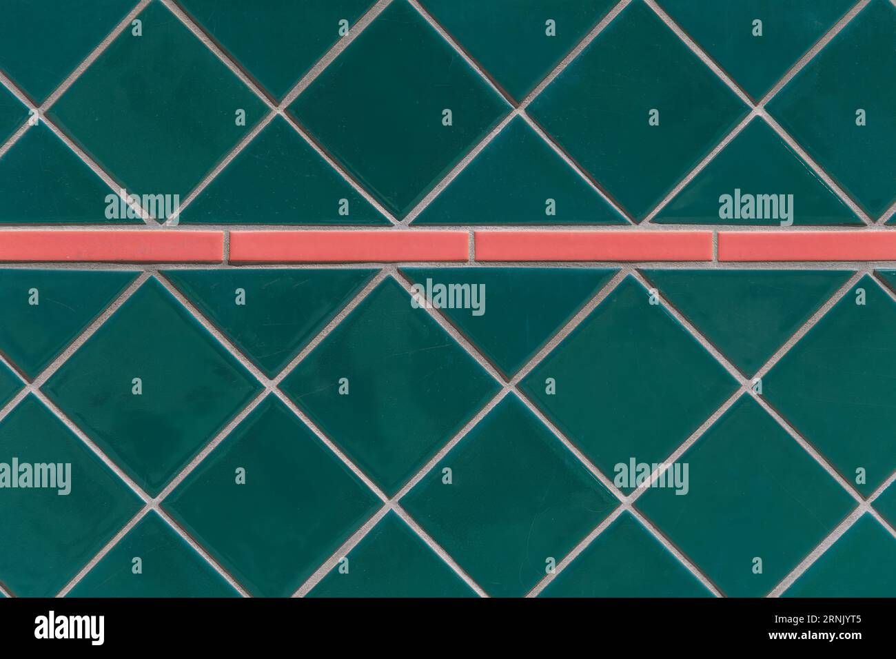 Green ceramic tile with contrasting pink tile accent Stock Photo Alamy