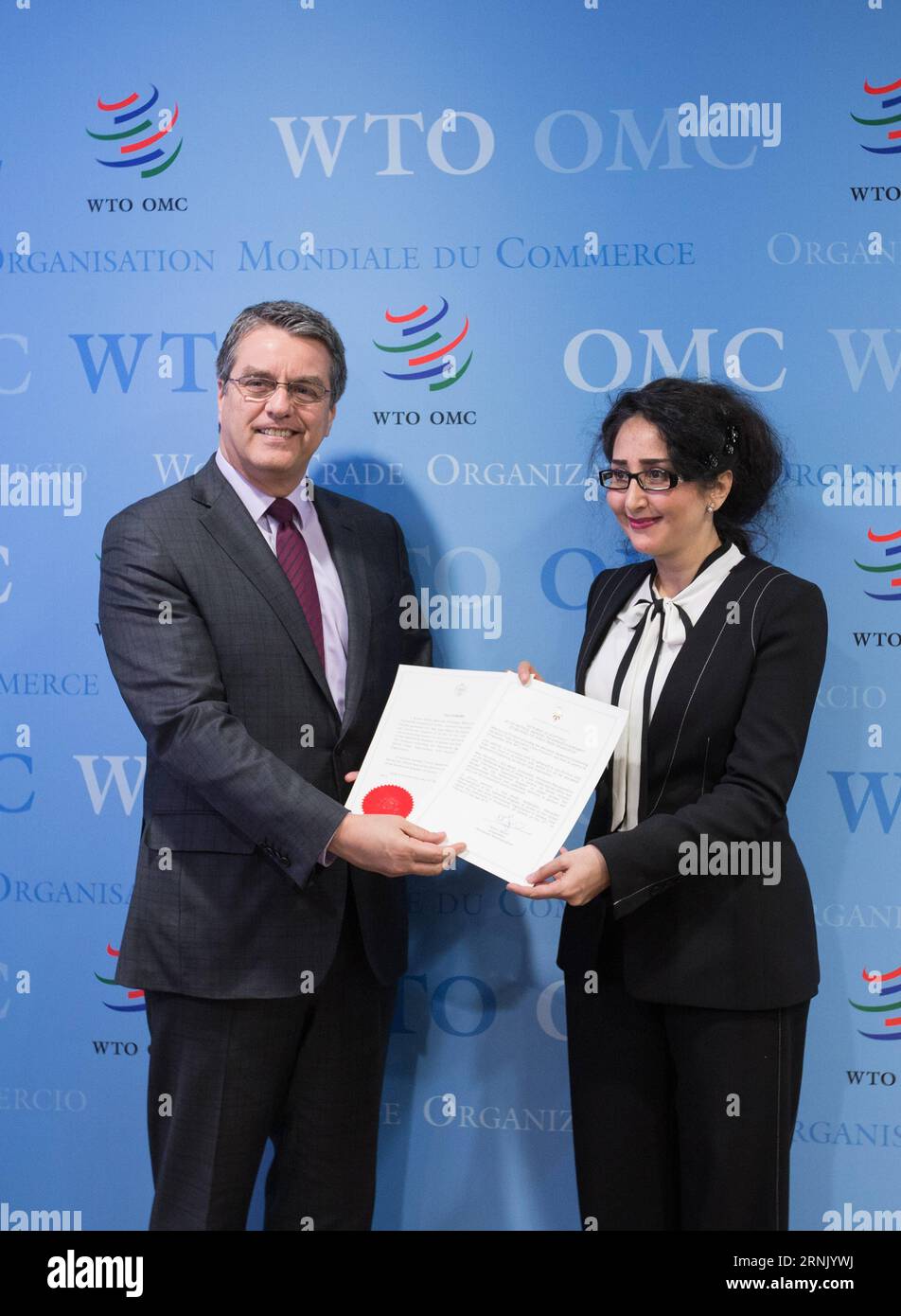 (170222) -- GENEVA, Feb. 22, 2017 -- The World Trade Organization (WTO) Director-General Roberto Azevedo (L) and Saja Majali, Ambassador and Permanent Representative of Jordan to the United Nations Office, show the signed document to the media in the headquarters of WTO in Geneva, Switzerland, Feb. 22, 2017. Azevedo announced on Wednesday the Trade Facilitation Agreement (TFA) entered into force after two-thirds of members have completed their domestic ratification process. Rwanda, Oman, Chad and Jordan on Wednesday submitted their ratifications of acceptance to Azevedo in WTO s headquarter in Stock Photo