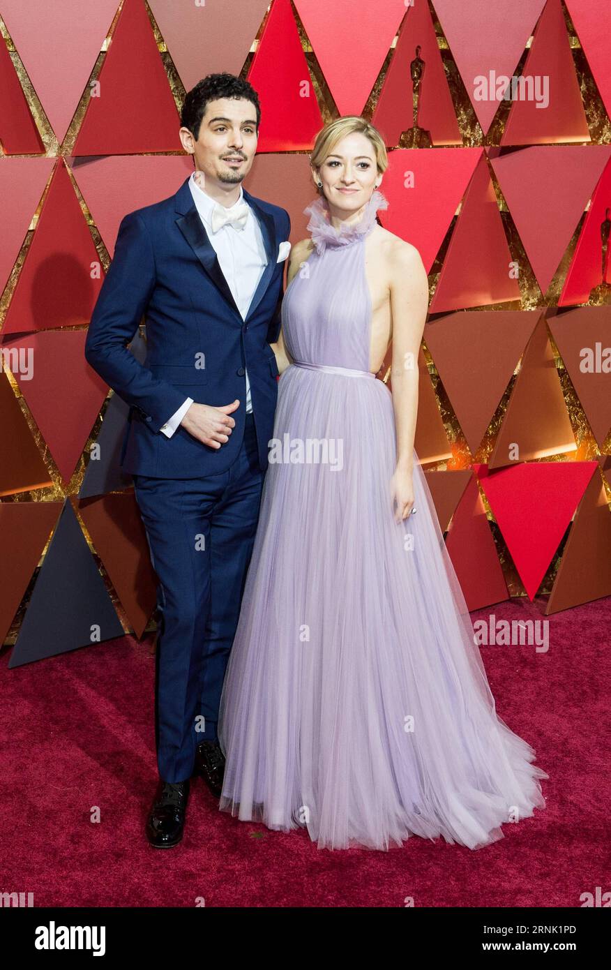 (170227) -- LOS ANGELES, Feb. 26, 2017 -- Director Damien Chazelle(L) and actress Olivia Hamilton arrive for the red carpet of the 89th Academy Awards at the Dolby Theater in Los Angeles, the United States, on Feb. 26, 2017. )(gj) U.S.-LOS ANGELES-OSCAR-RED CARPET YangxLei PUBLICATIONxNOTxINxCHN   Los Angeles Feb 26 2017 Director Damien Chazelle l and actress Olivia Hamilton Arrive for The Red Carpet of The 89th Academy Awards AT The Dolby Theatre in Los Angeles The United States ON Feb 26 2017 GJ U S Los Angeles Oscar Red Carpet YangxLei PUBLICATIONxNOTxINxCHN Stock Photo