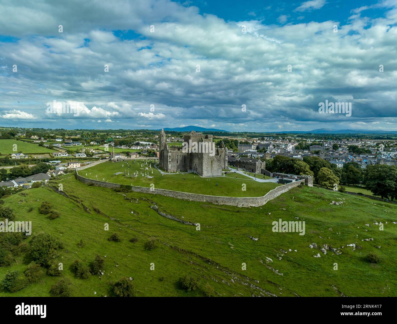 Aerial view of Rock of Cashel iconic Irish historic landmark with Romanesque chapel, a Gothic cathedral, an abbey, the Hall of the Vicars Choral and a Stock Photo