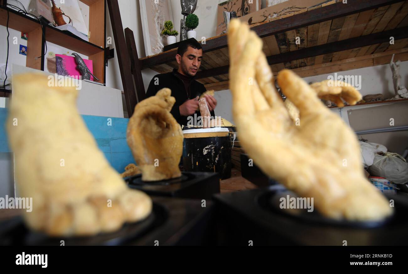 (170319) -- GAZA, March 19, 2017 -- Palestinian artist Mohammed Abu Hashish uses beeswax to produce models of human limbs to draw attention for the Palestinians who lost limbs in the fights with Israel, at his workshop, in the al-Maghazi refugee camp, in the centre of the Gaza Strip, on March 18, 2017. ) (zf) MIDEAST-GAZA-HUMAN-LIMB-ARTIST KhaledxOmar PUBLICATIONxNOTxINxCHN   Gaza March 19 2017 PALESTINIAN Artist Mohammed Abu Hashish Uses beeswax to Produce Models of Human Limbs to Draw Attention for The PALESTINIANS Who Lost Limbs in The Fights With Israel AT His Workshop in The Al Maghazi Re Stock Photo