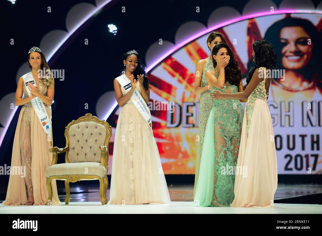 (170326) -- SUN CITY (SOUTH AFRICA), March 26, 2017 -- The first prize winner Demi-Leigh Nel-Peters (2nd R) reacts after the contest result was announced during the?Miss?South?Africa?2017 Pageant and Celebration in Sun City, North West Province,?South?Africa, on March 26, 2017. The?Miss?South?Africa?2017 Pageant and Celebration was held here Sunday. Demi-Leigh Nel-Peters from Sedgefield in the Western Cape Province, a 21-year-old part-time model, was crowned?Miss?South?Africa?2017 with a prize of one million rand (about 80,000 US dollars), and the runners-up are Ade van Heerden (1st Princess) Stock Photo