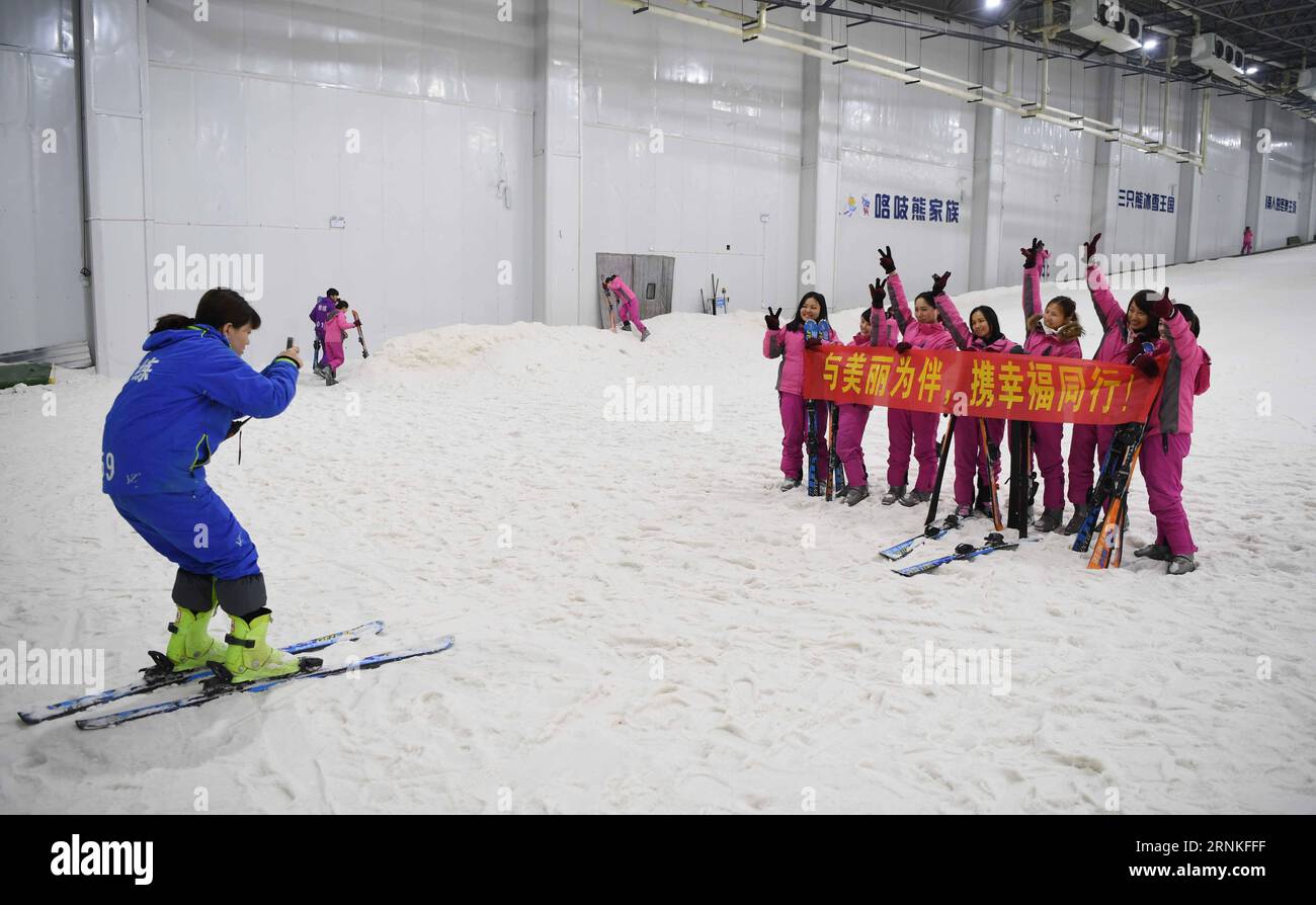 (170329) -- CHANGSHA, March 29, 2017 -- A group of ladies pose for photos in Snow Kingdom of Three Bears in Changsha, capital of central China s Hunan Province, on March 8, 2017. This nearly 10,000 square meters indoor ski venue was opened in 2015 and has accomodated over 100,000 visitors. With the benefit of Beijing winning the bid to host the 2022 Winter Olympics and Chinese government targeting attracting 300 million Chinese to participate in winter sports, the authorities of Hunan province takes winter sports industry more and more seriously and put it into the the five-year plan (from 201 Stock Photo