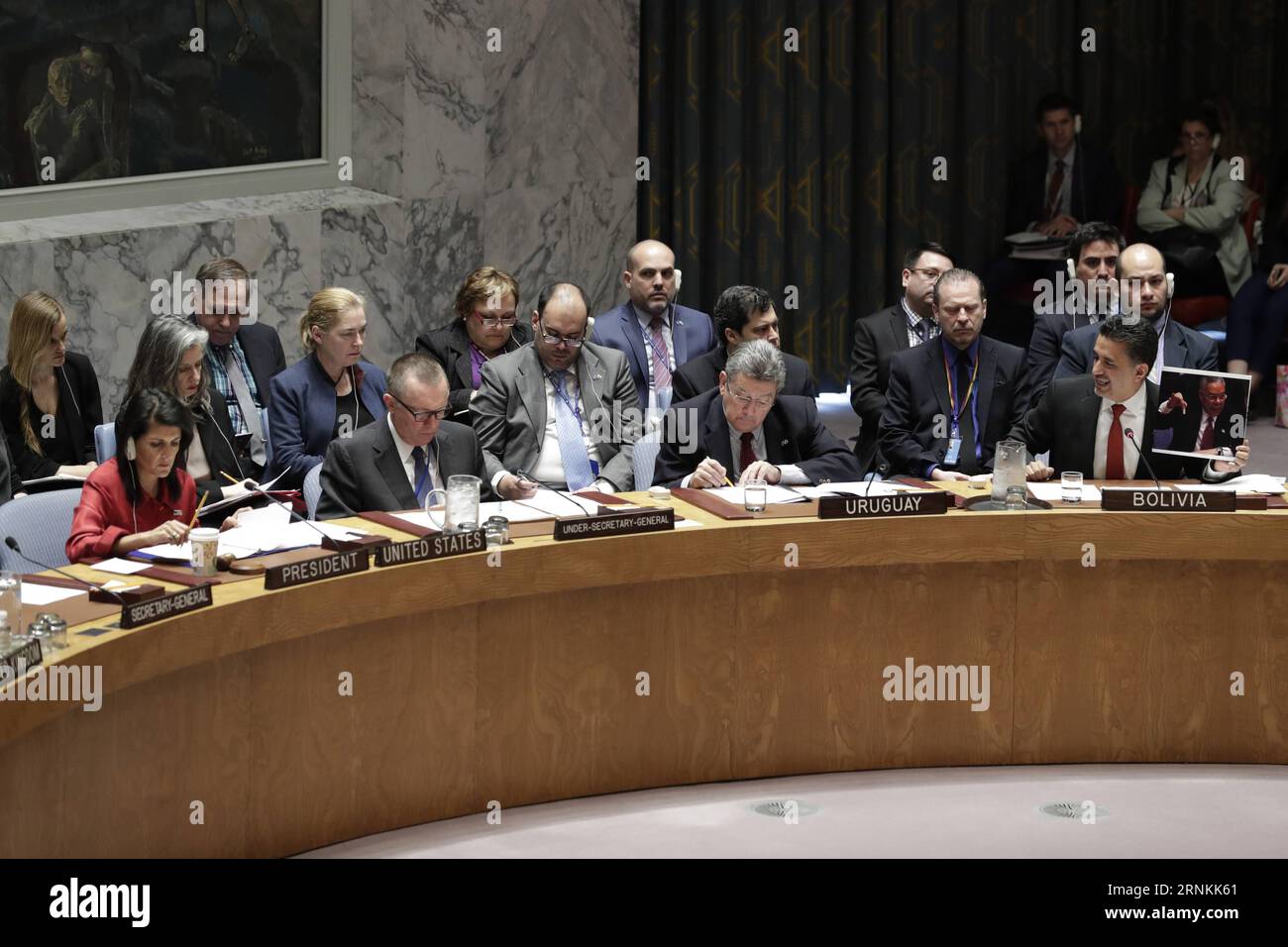 (170407) -- UNITED NATIONS, April 7, 2017 -- Sacha Llorentty Soliz (1st R, front row), Bolivian ambassador to the United Nations, holds a photo of former U.S. Secretary of State Colin Powell holding a vial containing what Powell had said was similar in appearance to a toxic substance, during a Security Council emergency session on the situation in Syria at the UN headquarters in New York, on April 7, 2017. A divided UN Security Council met on Friday in emergency session to debate the U.S. cruise missile attack on an airfield in Syria where Washington asserted aircraft were launched to drop che Stock Photo