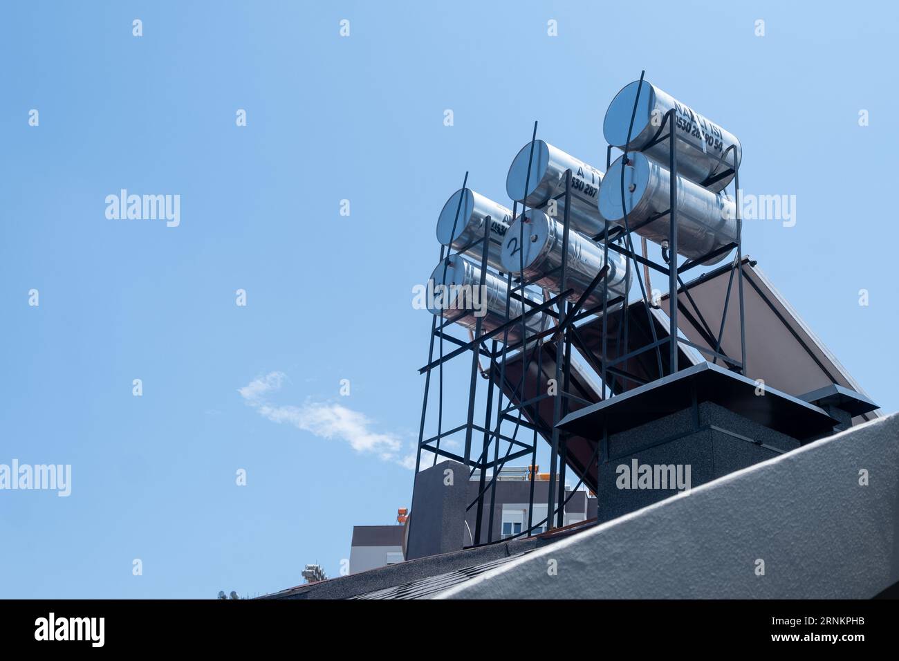 Water tanks on the roof of a residential building in Antalya Stock