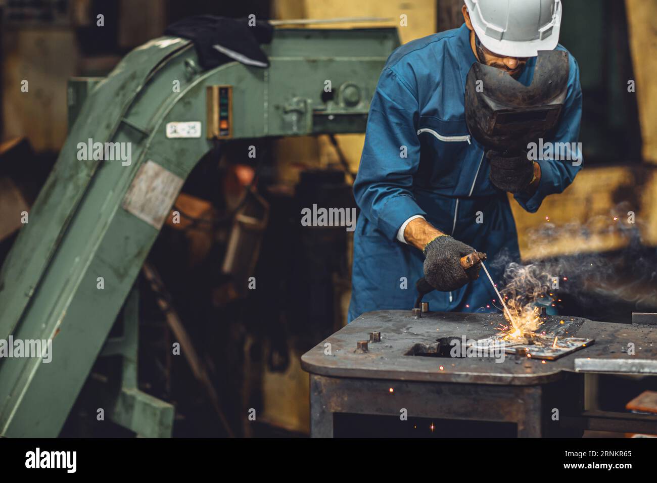 welding worker team working arc weld metal joint production in heavy industry danger and risk