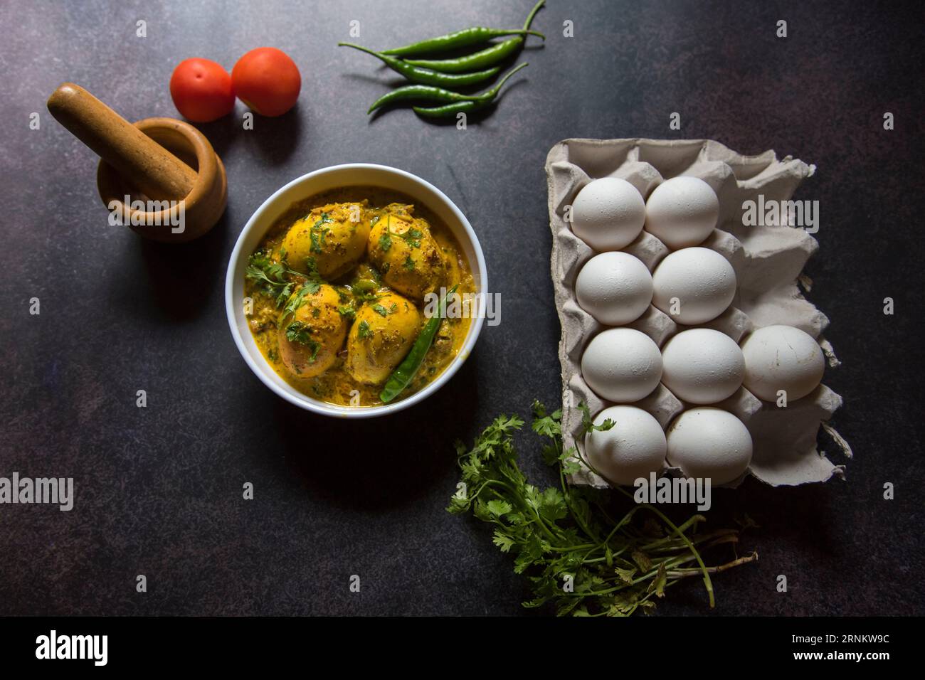 Egg masala curry in mustard sauce served in a bowl. Stock Photo