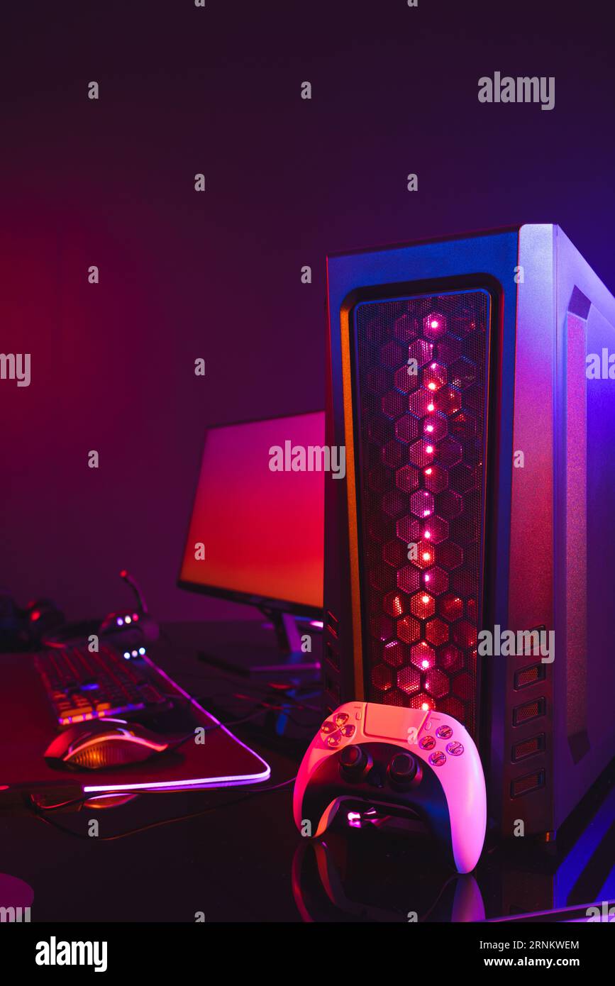 Vertical image of computer with video game accessories with copy space