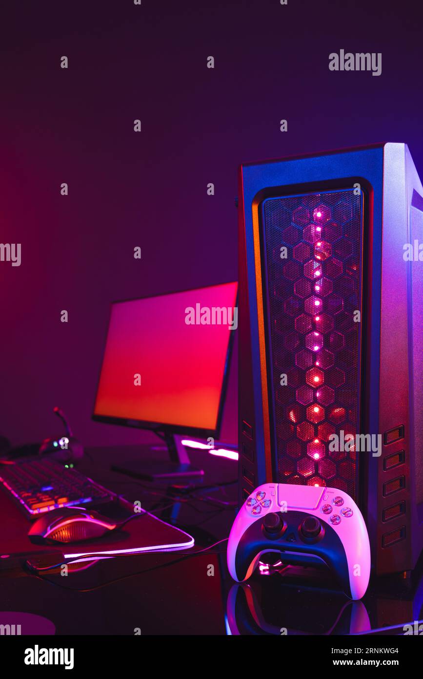 Vertical image of computer with video game accessories with copy space