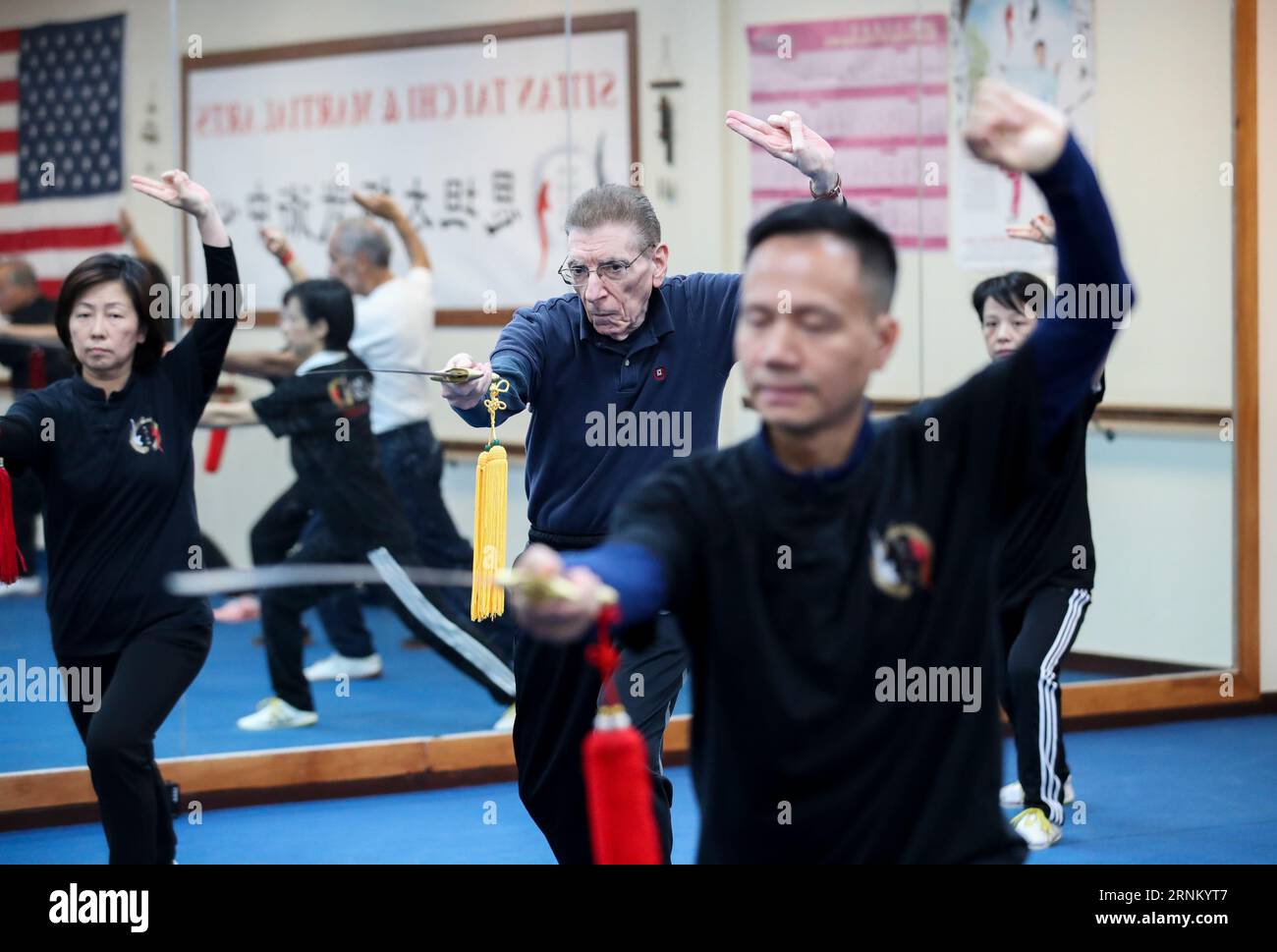 Beijing, USA. 20th Nov, 2019. Chen Sitan (front) practices Tai Chi Sword with students at Sitan Tai Chi and Martial Arts, a martial art school in Syosset of New York, the United States, Nov. 20, 2019. TO GO WITH 'Guest Opinion: Resetting China-U.S. relations through people' Credit: Wang Ying/Xinhua/Alamy Live News Stock Photo