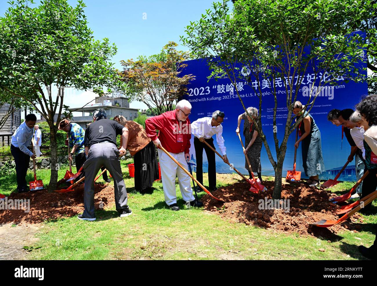 Beijing, China's Fujian Province. 28th June, 2023. Guests attending a symposium of the Kuliang Friends plant trees in Fuzhou, southeast China's Fujian Province, June 28, 2023. TO GO WITH 'Guest Opinion: Resetting China-U.S. relations through people' Credit: Wei Peiquan/Xinhua/Alamy Live News Stock Photo