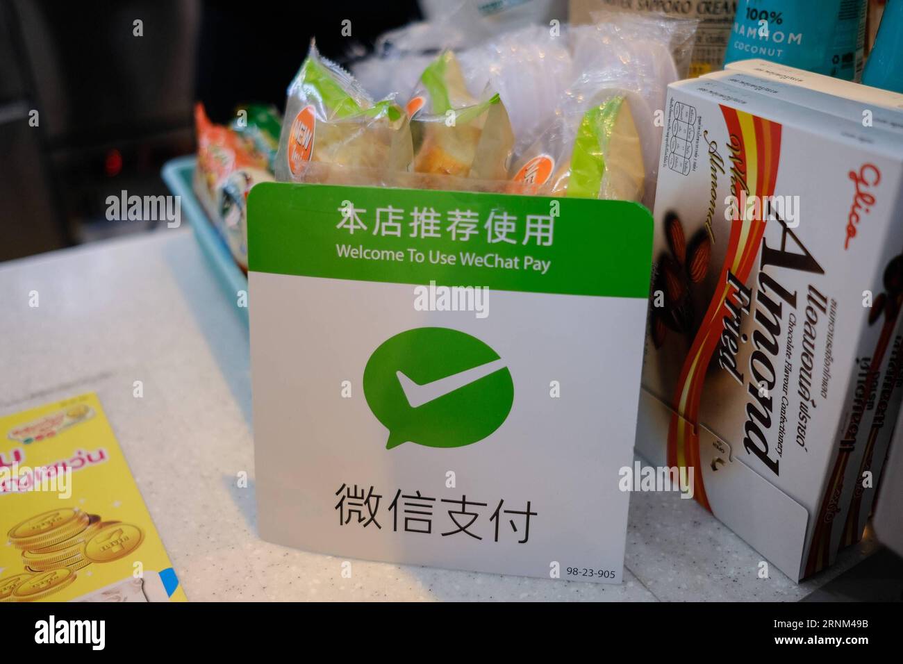 (170508) -- BEIJING, May 8, 2017 -- A plate of Wechat Pay is shown at the counter of a store in Bangkok, Thailand, May 5, 2017. It is a common thing in China to take no cash and pay with a smartphone, which is installed with China s Alipay or Wechat apps. With a smartphone, people can pay almost everything such as shopping, repairing car, paying a taxi and registering a hospital. In many other countries, payment with Alipay and Wechat is becoming a new trend. Alipay s parent company, Ant Financial Services Group or Ant Financial, has more than 200 million users in 25 countries and regions. Wec Stock Photo