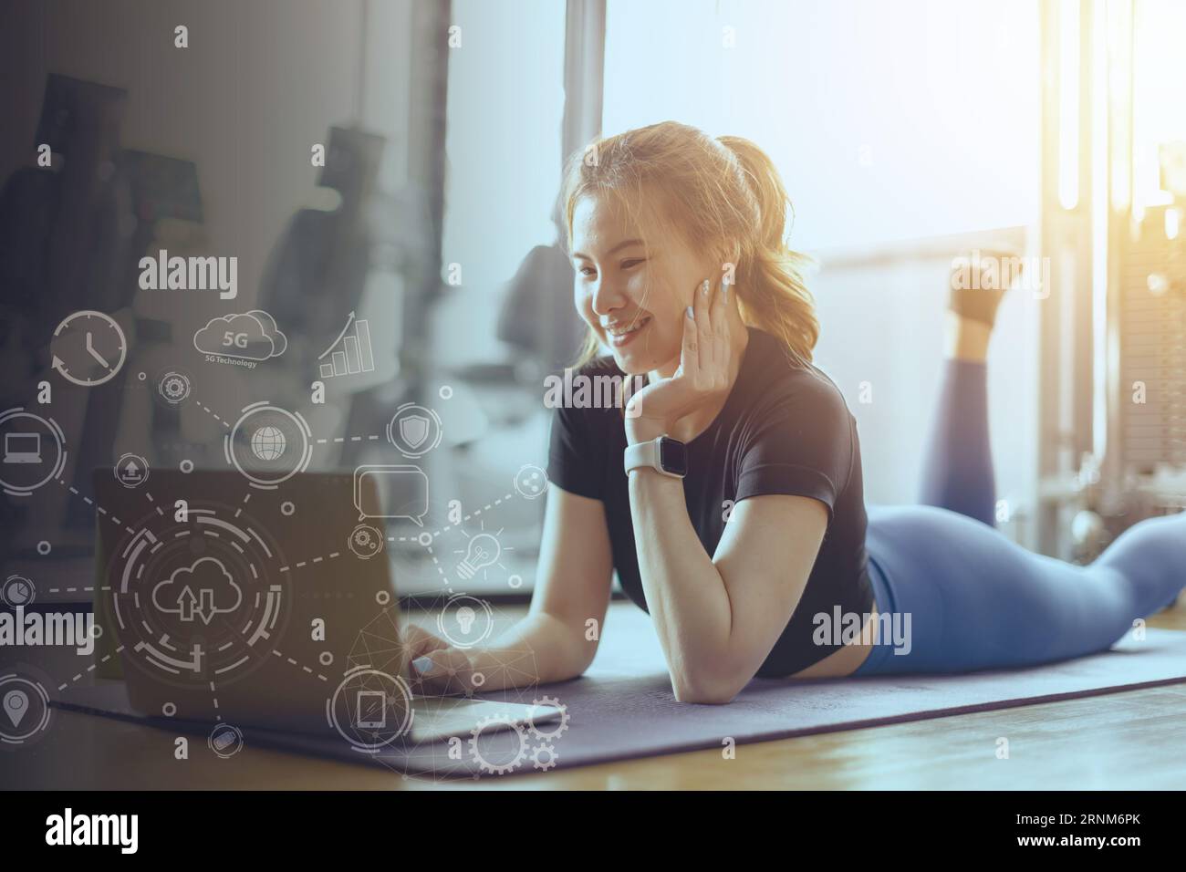 fitness lady relax smiling in gym body exercise activity leisure holiday. Happy healthy lifestyle young woman watching a laptop. Stock Photo