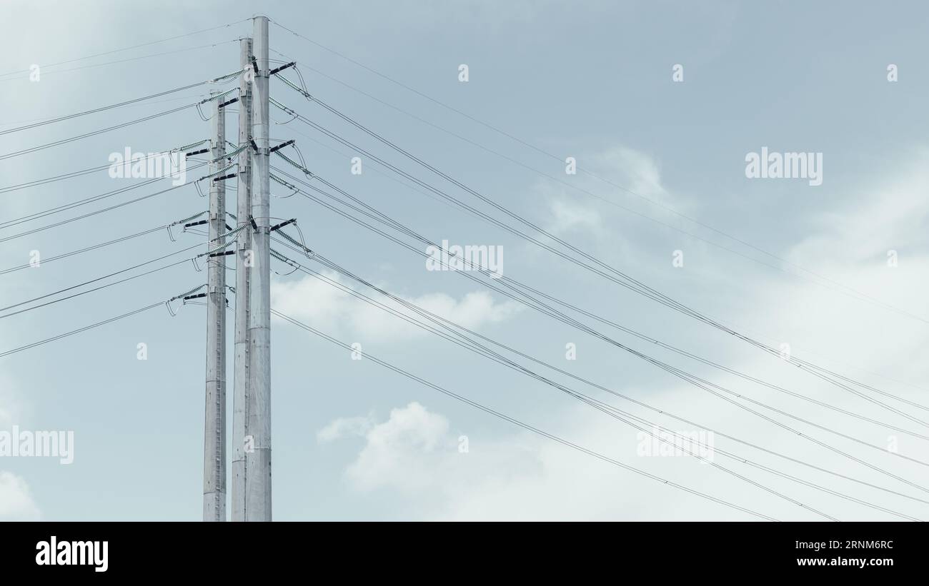 Monopoles Electric Transmission Poles for Hight voltage long range energy transport for urban city metro power infrastructure landscape view Stock Photo
