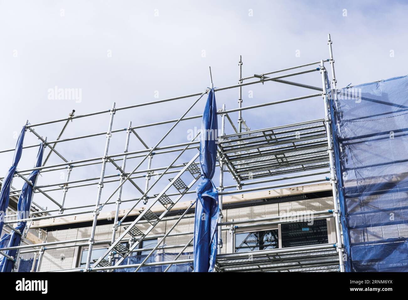 underconstruction home building with scaffolding stucture support ...