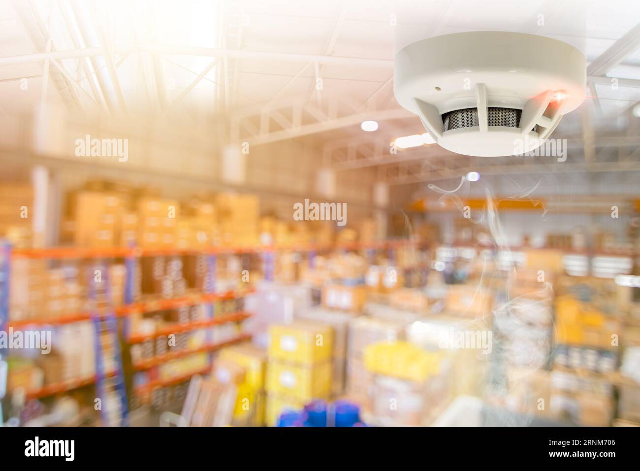 Fire Alarms for Warehouse Smoke Detector Fire Detector safety device setup at Cargo Storage Area ceiling Stock Photo