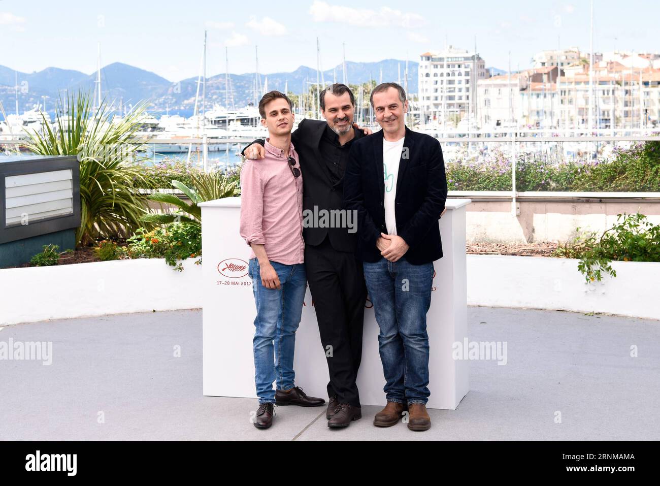 (170519) -- CANNES, May 19, 2017 -- Actor Zsombor Jeger, director Kornel Mundruczo and actor Merab Ninidze (from L to R) of the film Jupiter s Moon pose for a photocall in Cannes, France, on May 19, 2017. The film Jupiter s Moon directed by Hungarian director Kornel Mundruczo will compete for the Palme d Or on the 70th Cannes Film Festival. )(gl) FRANCE-CANNES-70TH CANNES FILM FESTIVAL-IN COMPETITION-JUPITER S MOON-PHOTOCALL ChenxYichen PUBLICATIONxNOTxINxCHN   Cannes May 19 2017 Actor  Jeger Director Kornel Mundruczo and Actor Merab Ninidze from l to r of The Film Jupiter S Moon Pose for a ph Stock Photo