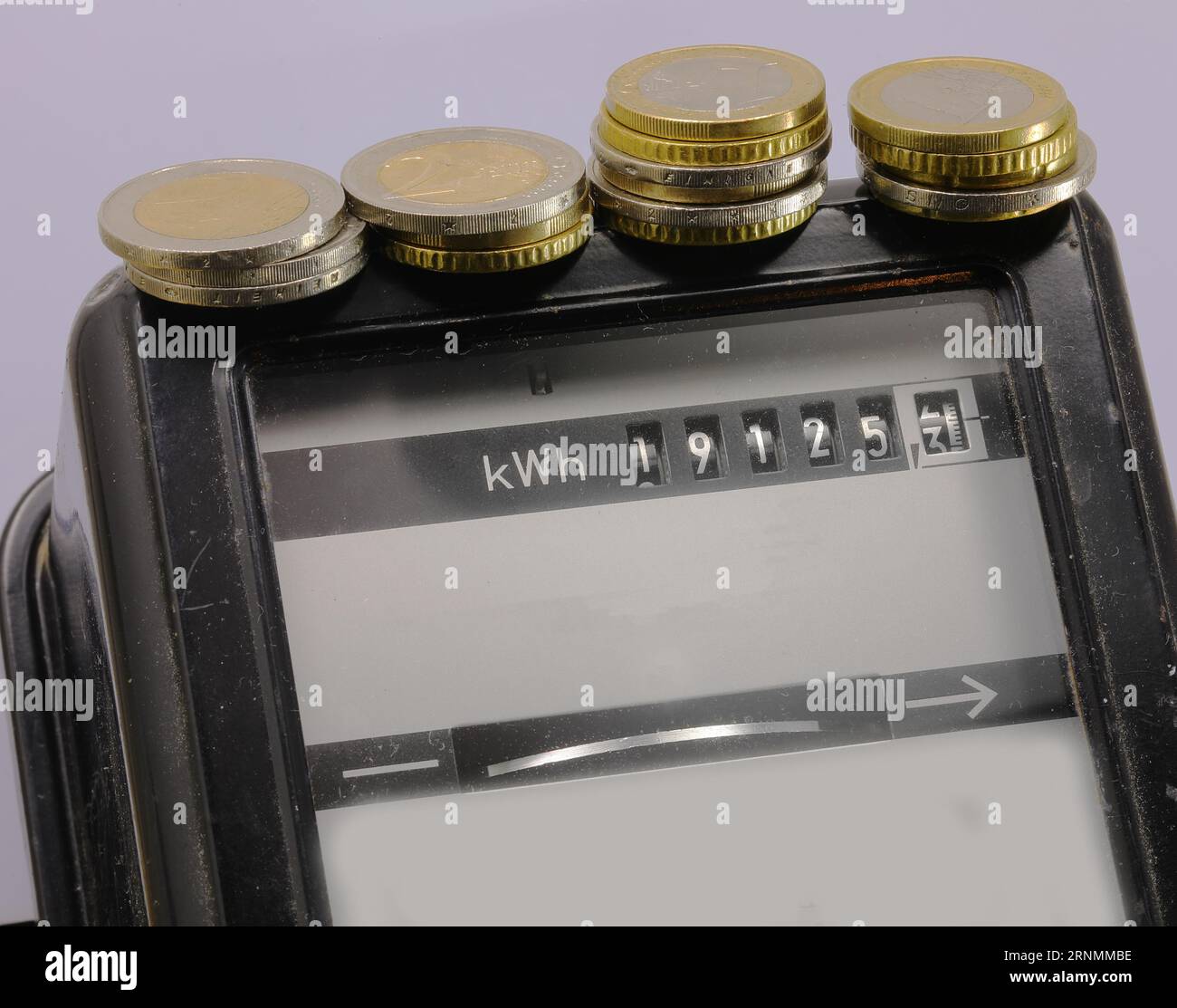 electric current meter with european euro coins on it for energy costs ...