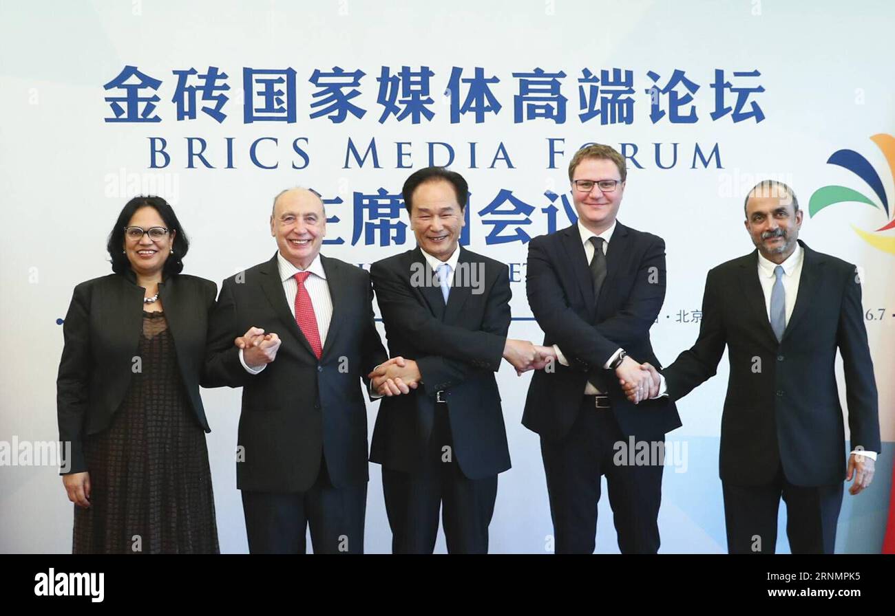 (170607) -- BEIJING, June 7, 2017 -- Cai Mingzhao (C), president of China s Xinhua News Agency and executive president of the BRICS Media Forum, poses for a photo with Jose Juan Sanchez (2nd L), president of Brazil s CMA group, Oleg Osipov (2nd R), first deputy editor-in-chief of Russia s Sputnik News Agency and Radio, Mukund Padmanabhan (1st R), editor of India s The Hindu, and Zenariah Barends (1st L), chief of staff of South Africa s Independent Media, after a presidium meeting of the BRICS Media Forum in Beijing, capital of China, June 7, 2017. ) (zwx) CHINA-BEIJING-BRICS MEDIA FORUM-PRESI Stock Photo